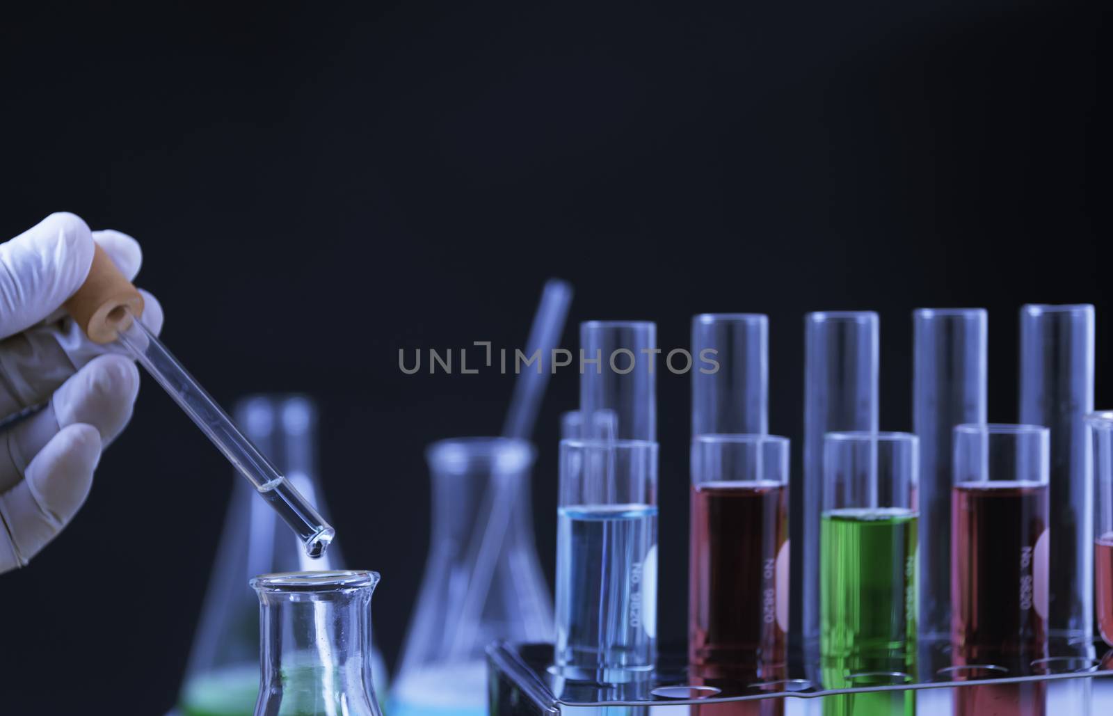 Glass laboratory chemical test tubes with liquid for analytical , medical, pharmaceutical and scientific research concept.