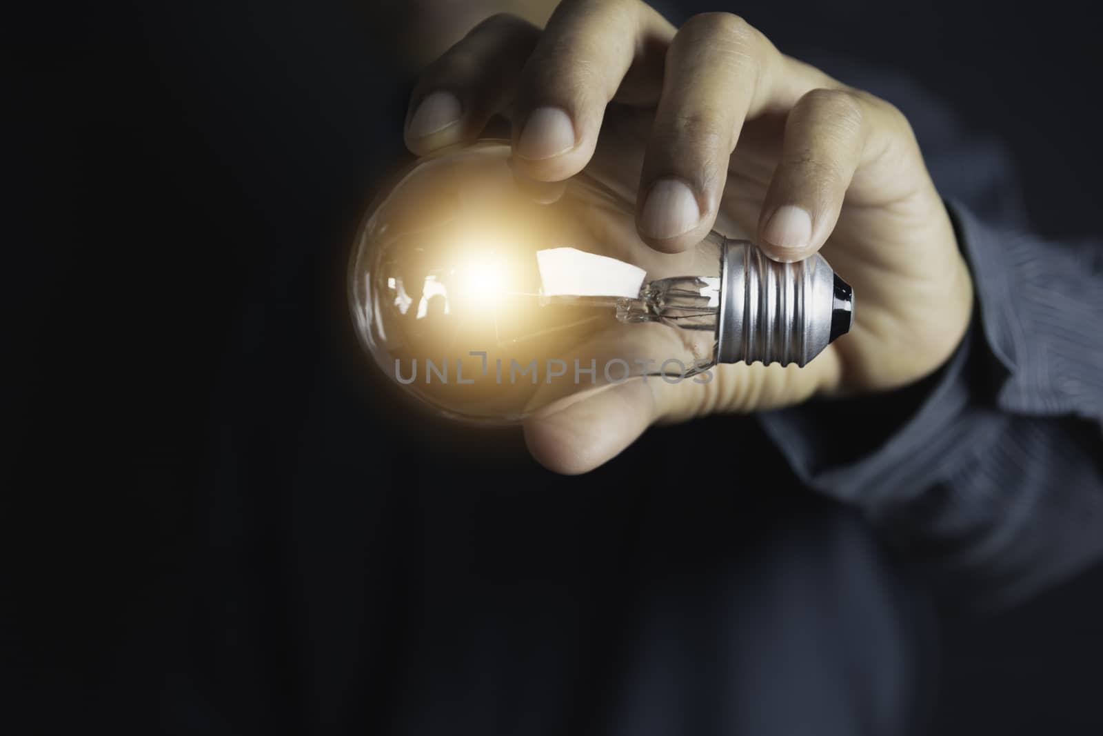 Innovation or creative concept of hand hold a light bulb and copy space for insert text.