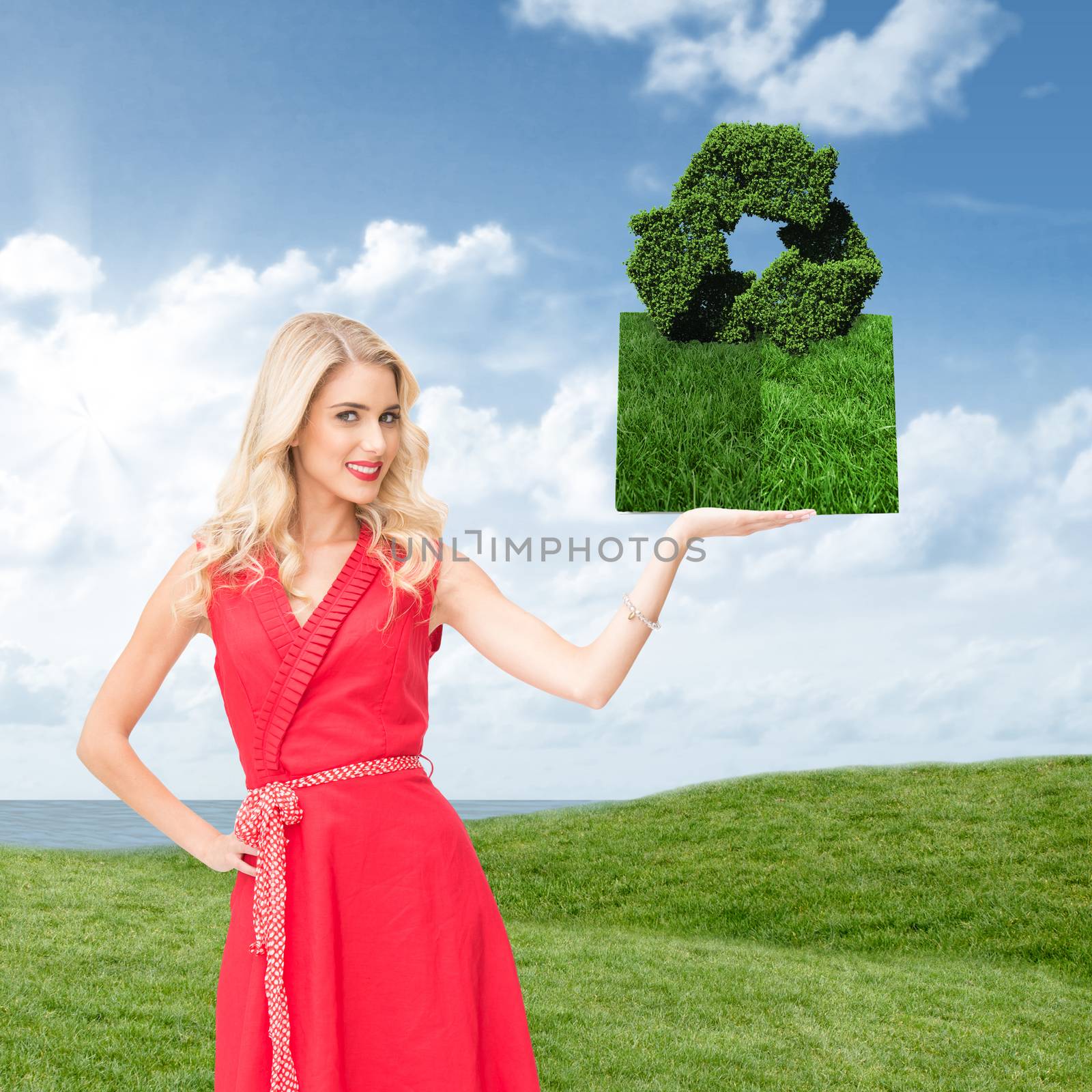 Woman holding lawn book against green field under blue sky