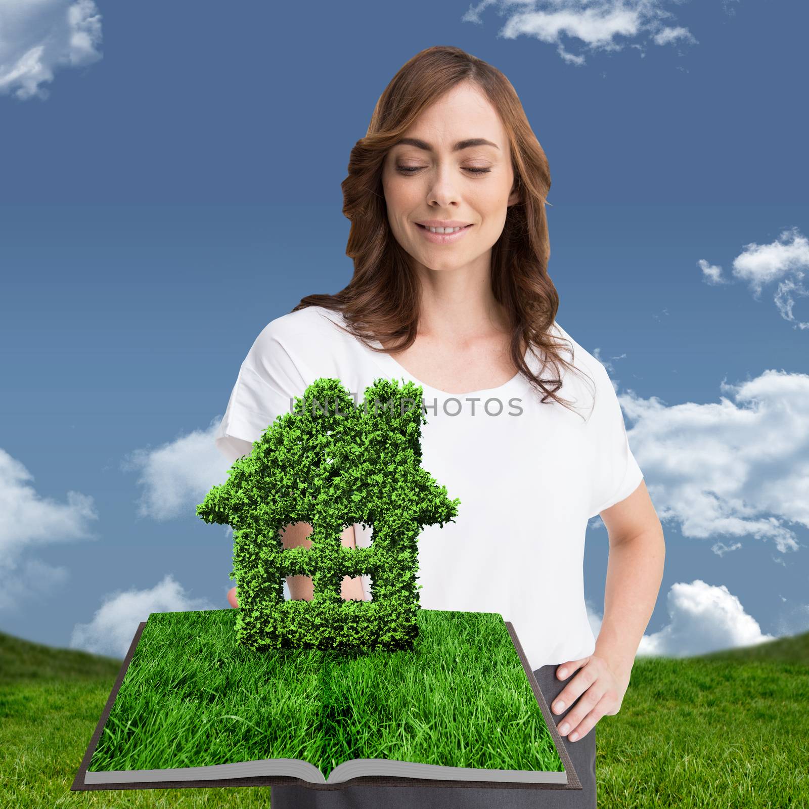 Woman holding lawn book against grass and sky