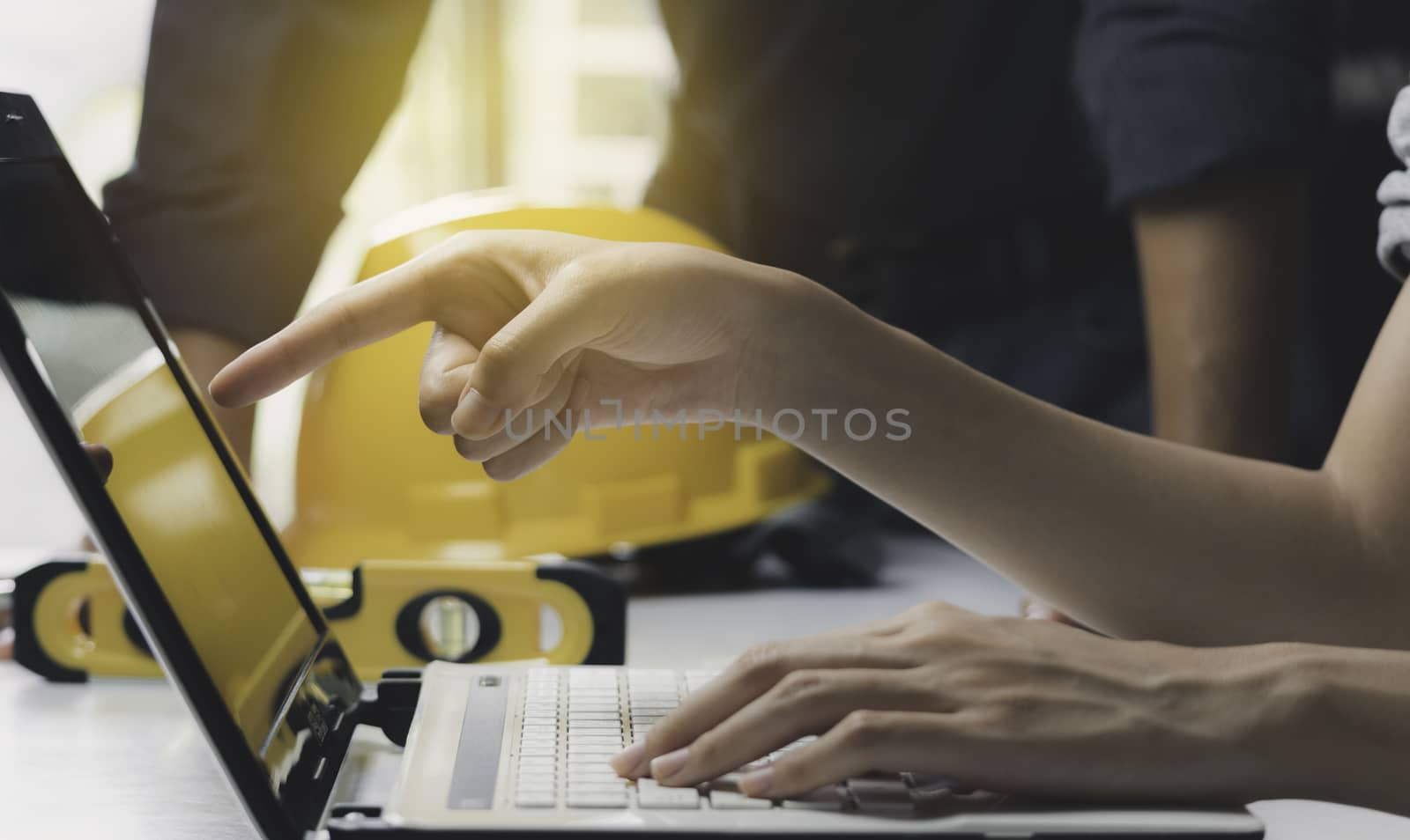 Architect engineer working concept and construction tools or safety equipment on table.