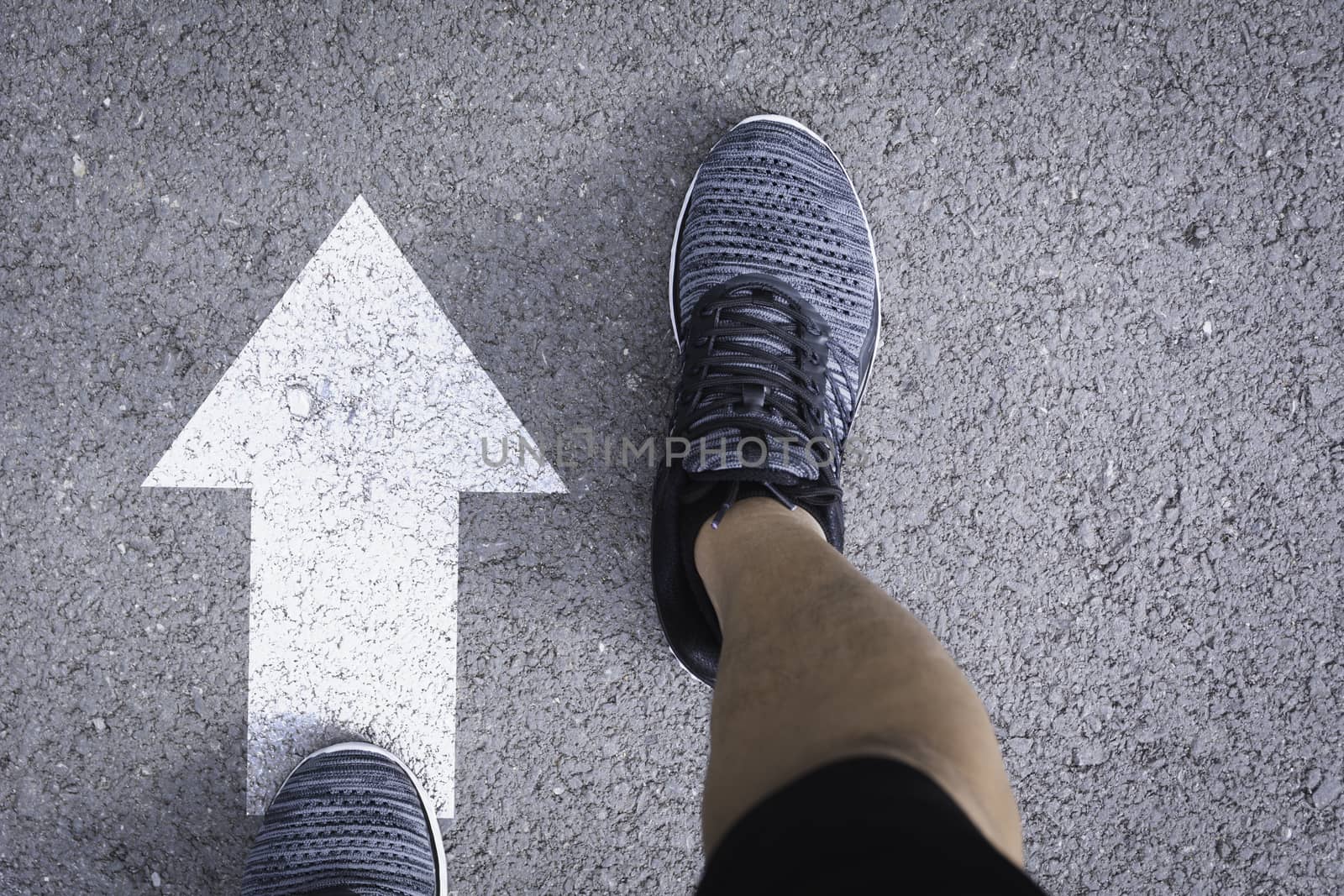 Top view of man wearing shoes choosing a way marked with white a by kirisa99