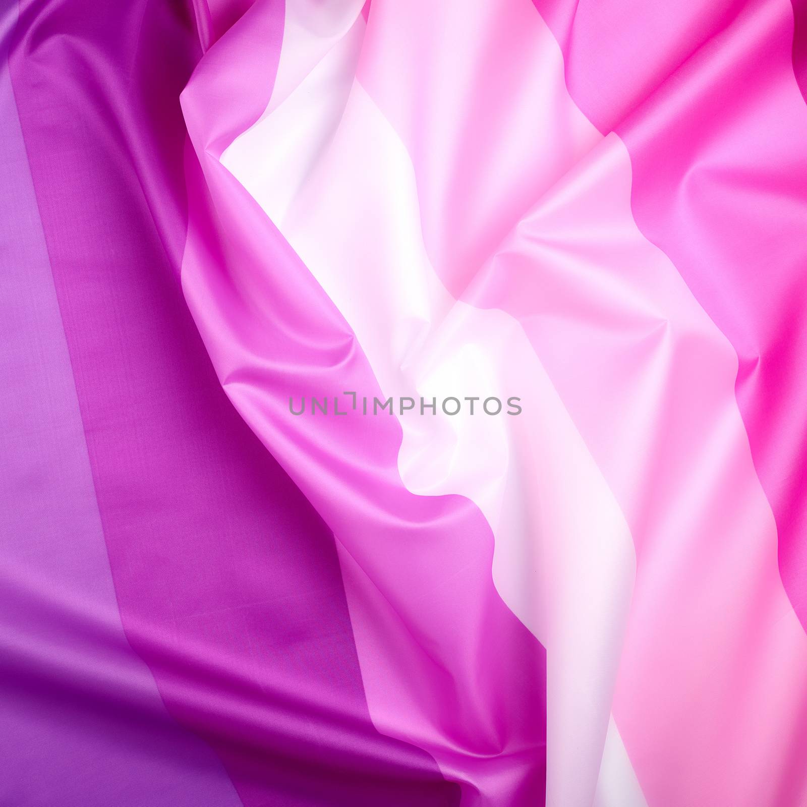textile pink flag of lesbians, concept of the fight for equal rights and against sexual discrimination, surface waves, full frame