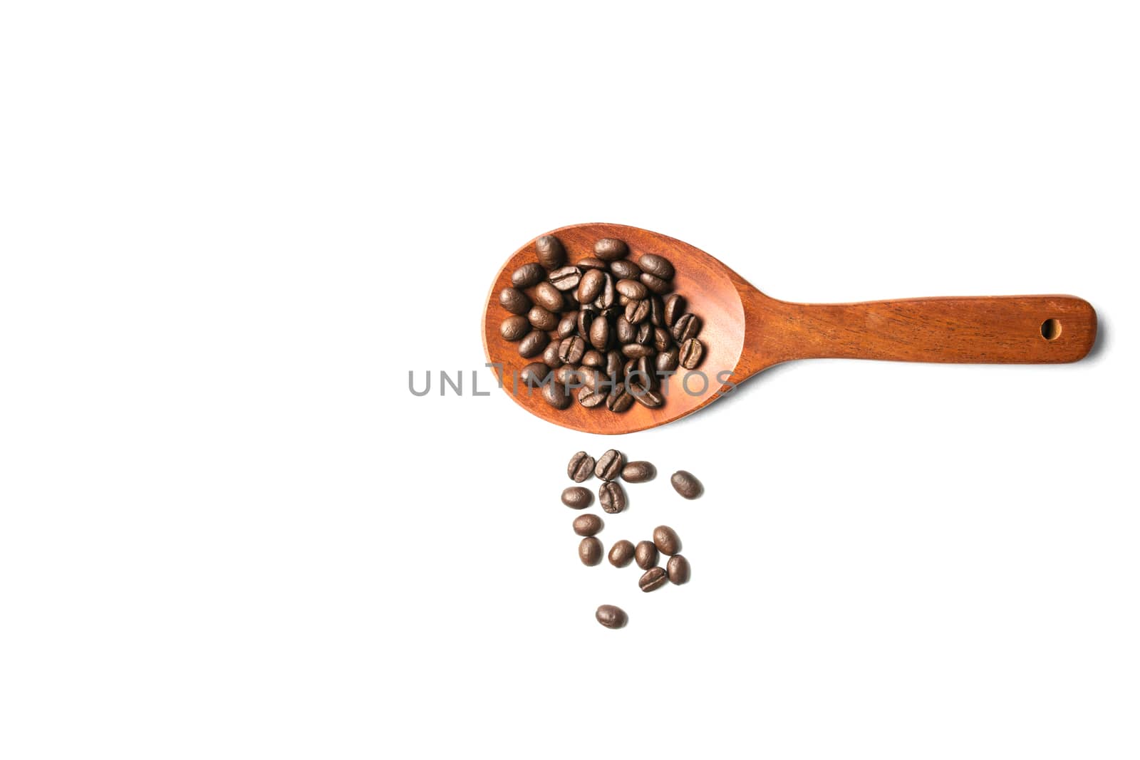 A wooden spoon with spread coffee beans isolated on white backgr by kirisa99