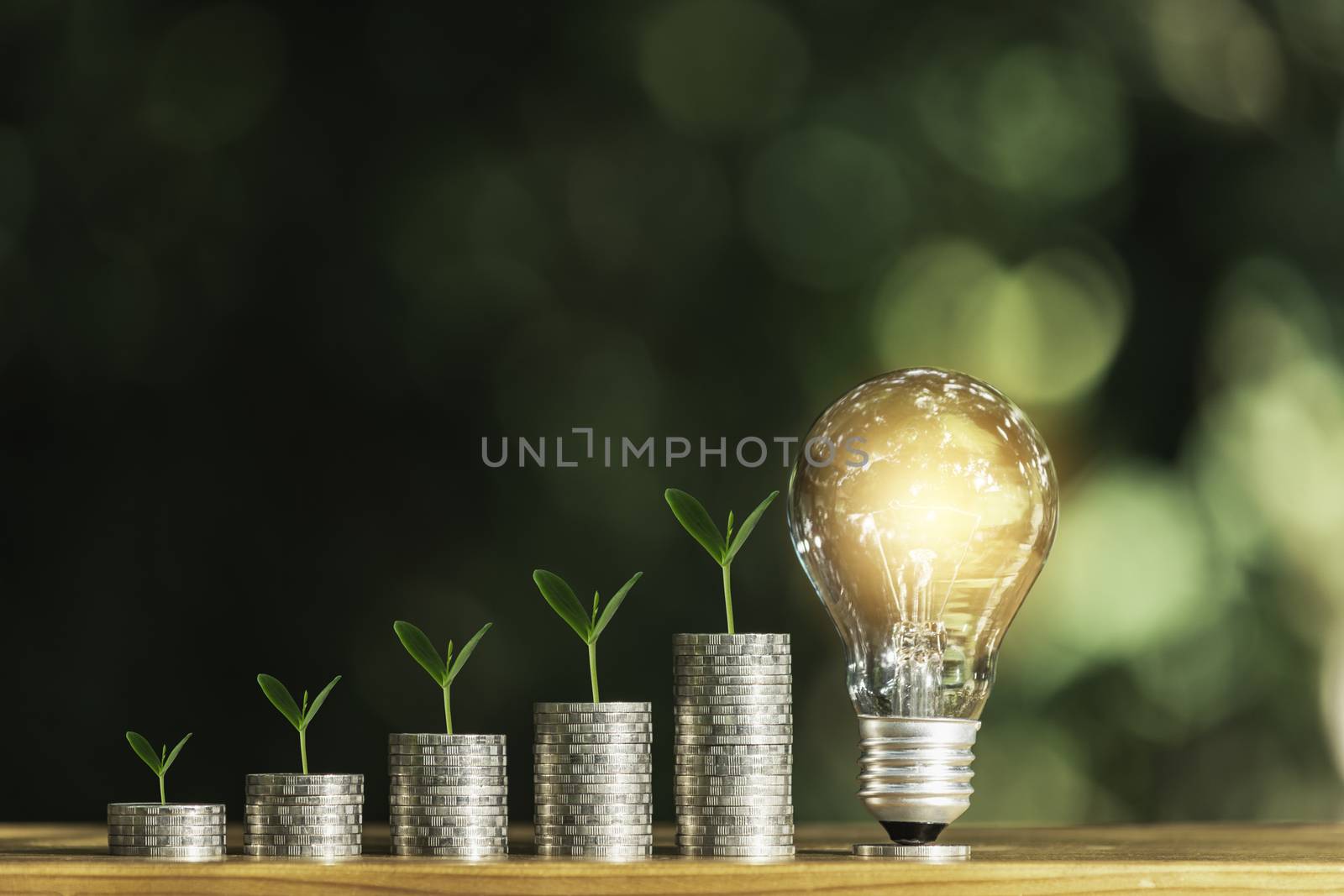 Light bulb with stack of coins and copy space for accounting, bu by kirisa99
