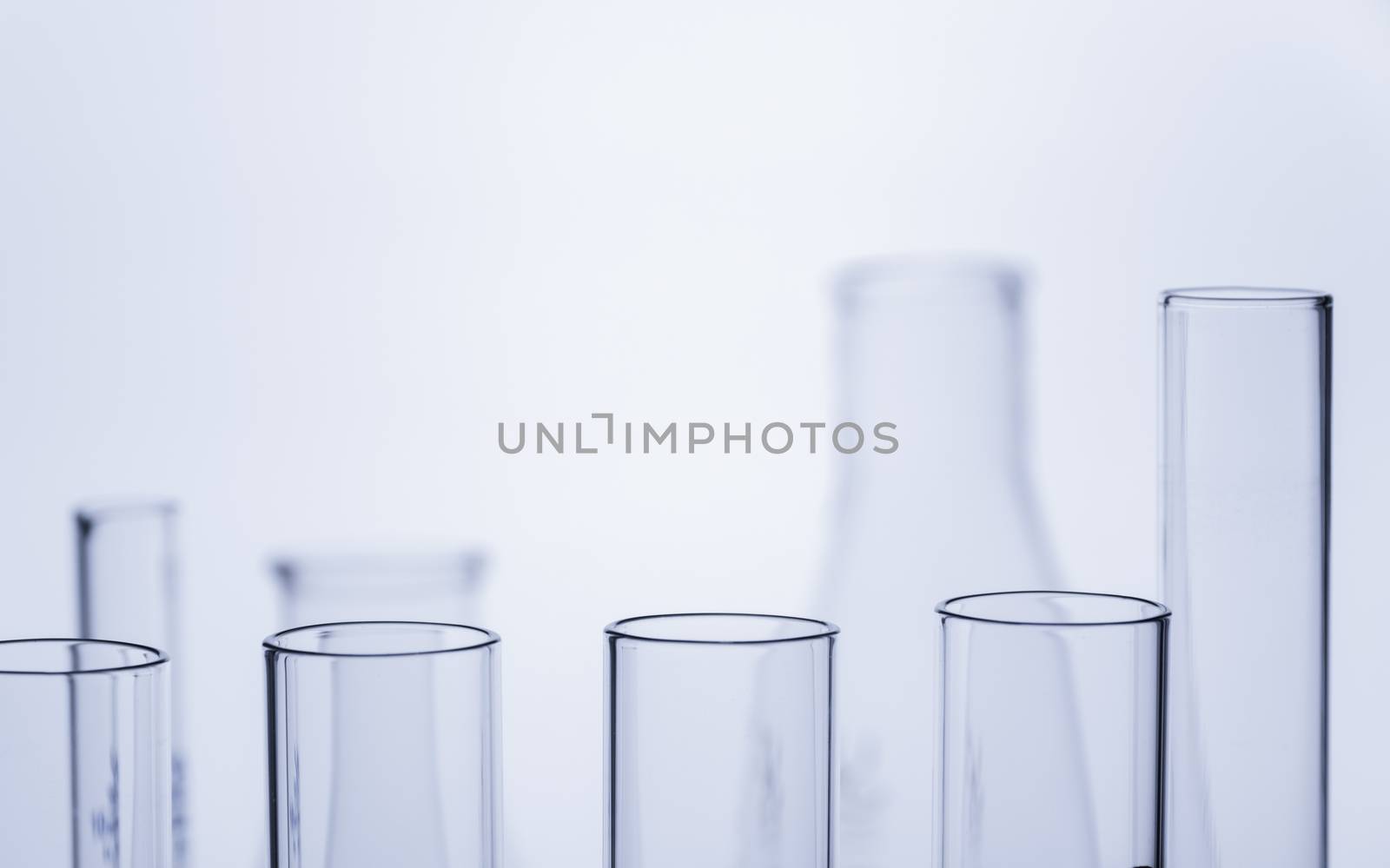 Glass laboratory chemical test tubes with liquid for analytical  by kirisa99