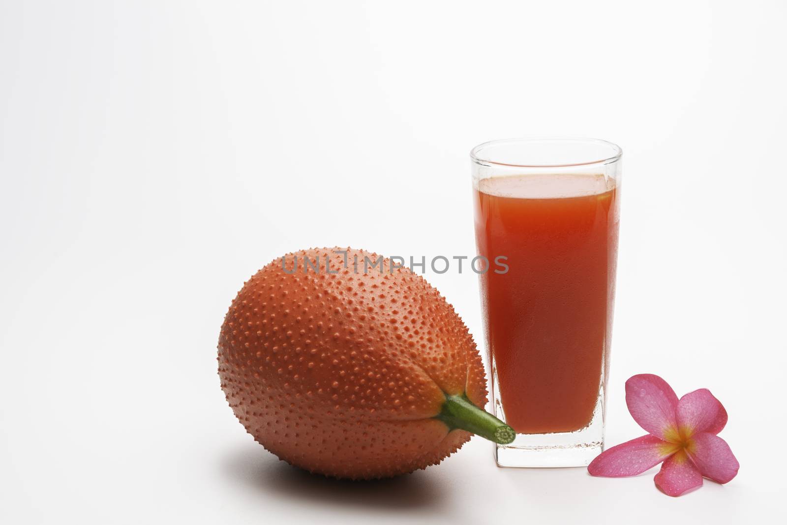 Baby Jackfruit, Gac fruit with baby jackfruit juice isolated on white background. Drink and healthy concept.