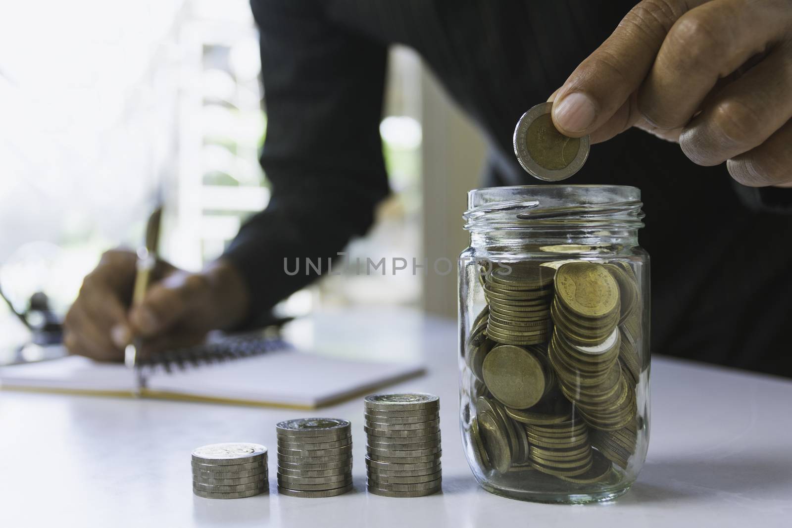 Hand drop a coin with money coin stack growing for business. fin by kirisa99