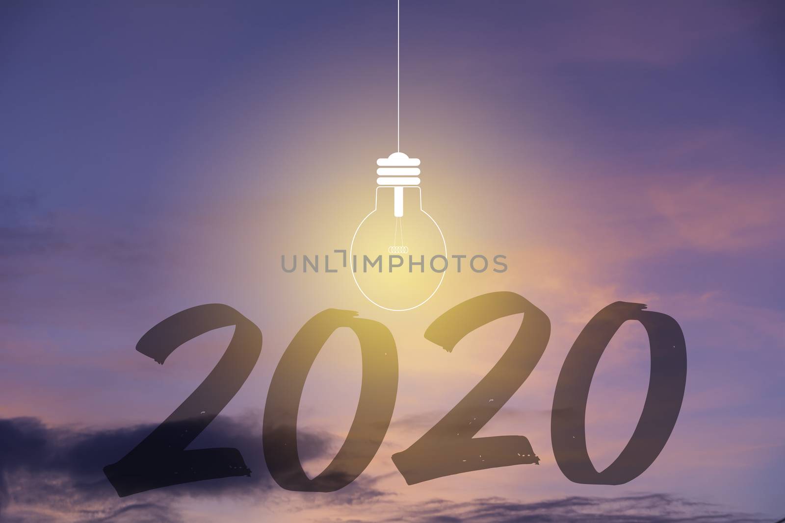 2020 Happy new year numbers with light bulb on sunset sky background