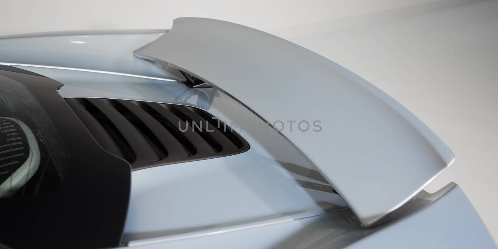 Close up of rear spoiler on car by camerarules