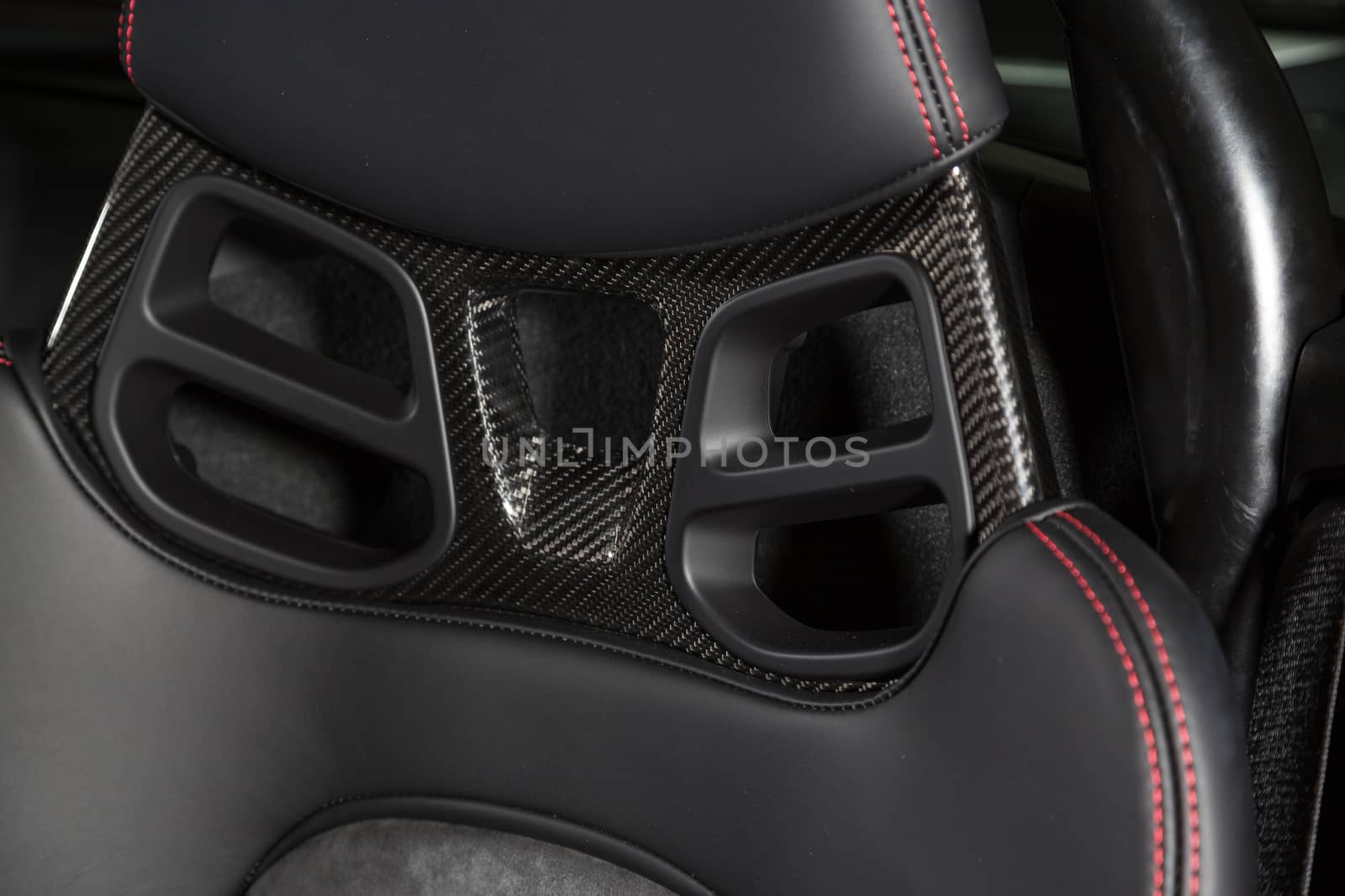 Close up of carbon fibre car seat headrest by camerarules