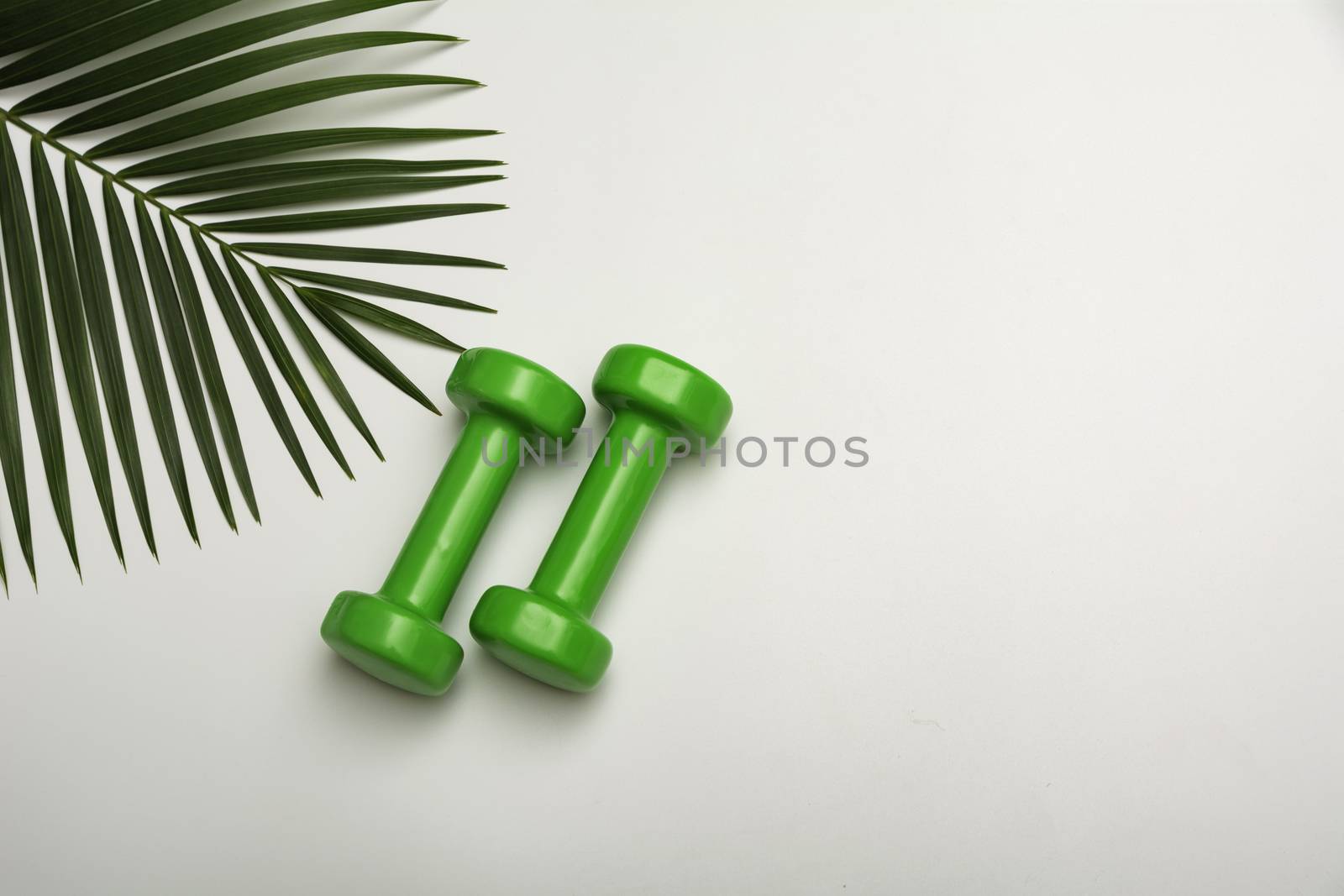 Concept preparing to fitness sports equipment with dumbbell on w by kirisa99