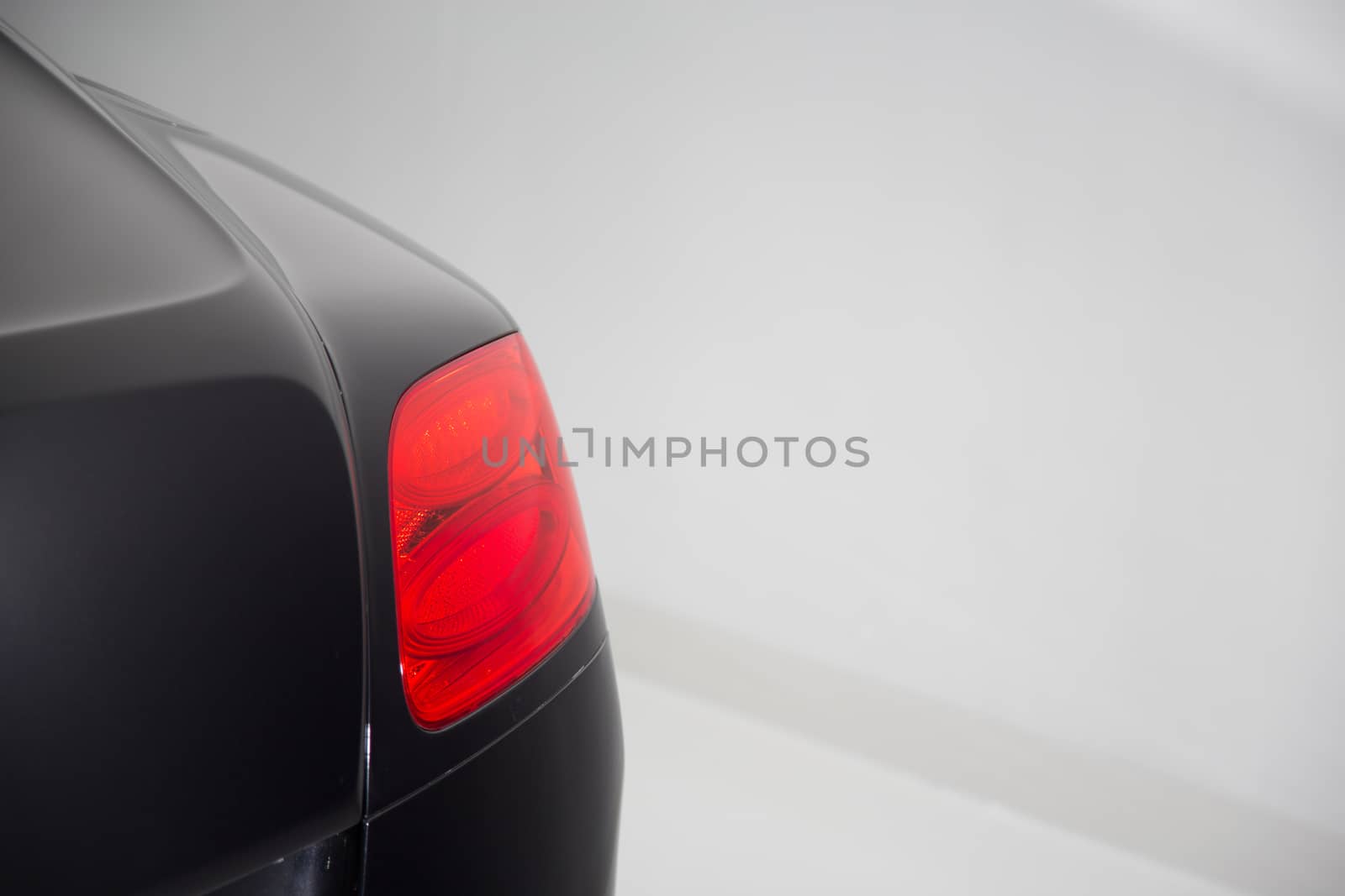 Close up of rear light on luxury car exterior by camerarules