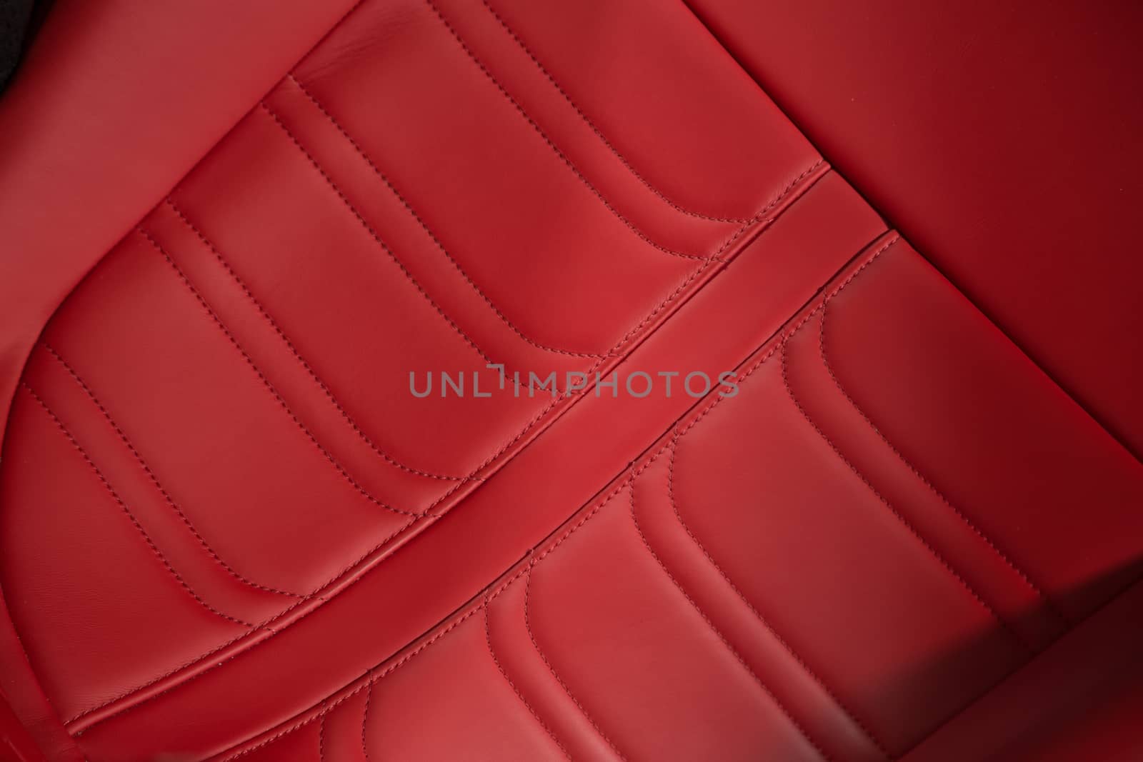 Close up of leather car seat in red