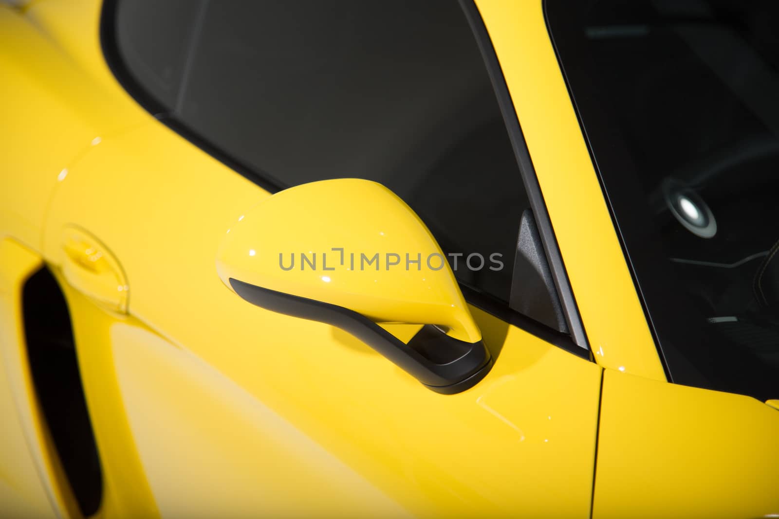 Yellow sports car mirror
