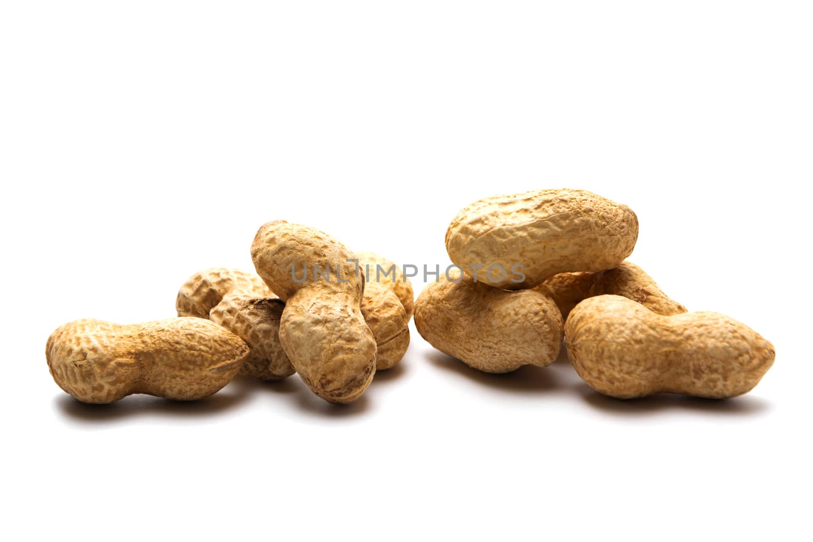 Peanut in a shell isolated on white background. Dried peanuts in closeup.