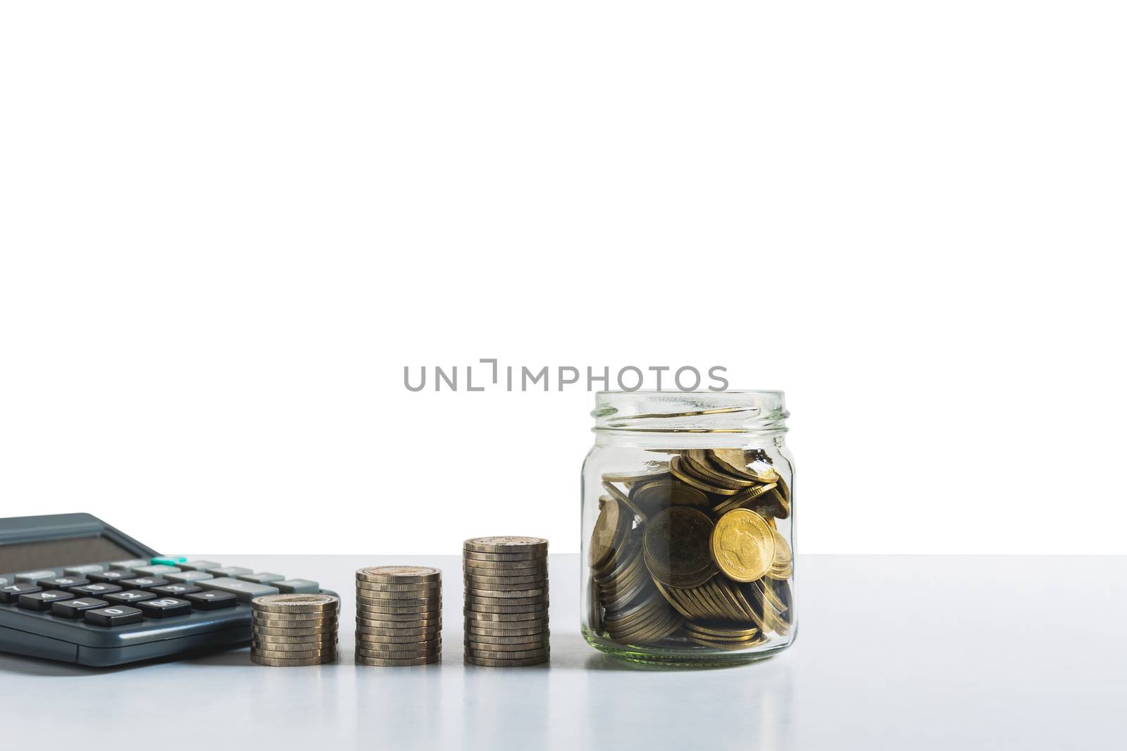 Saving money concept with money coin stack. Financial and accoun by kirisa99