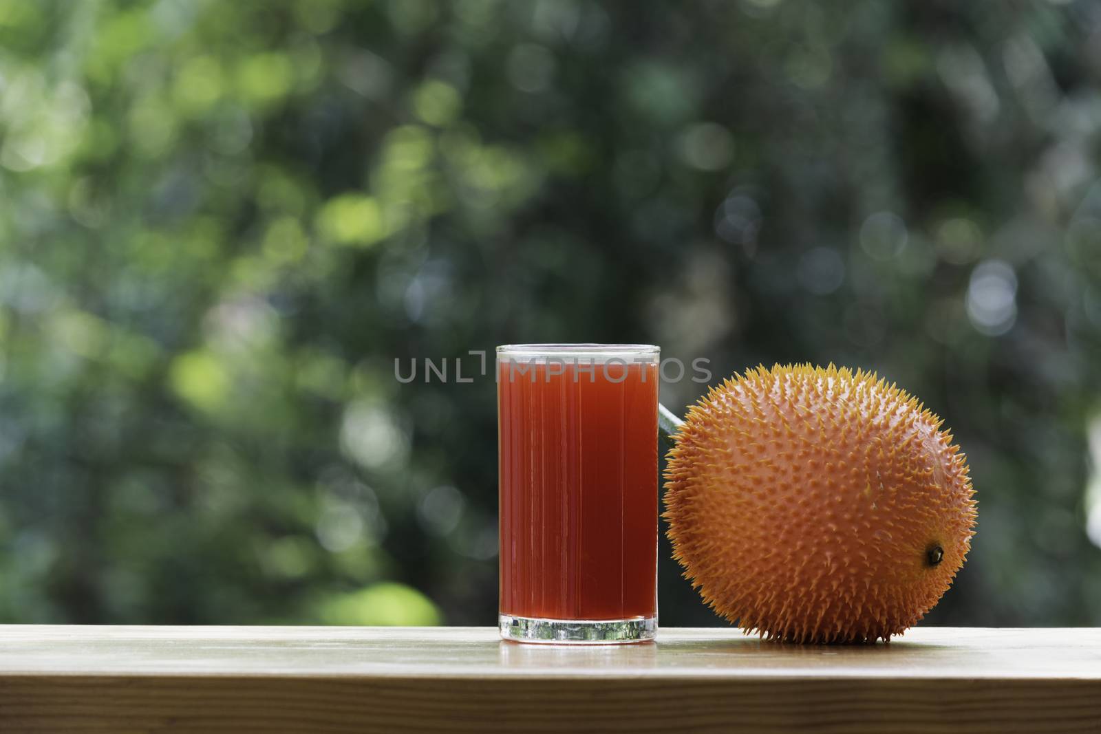 Baby Jackfruit, Gac fruit with baby jackfruit juice on blurred background. Drink and healthy concept.