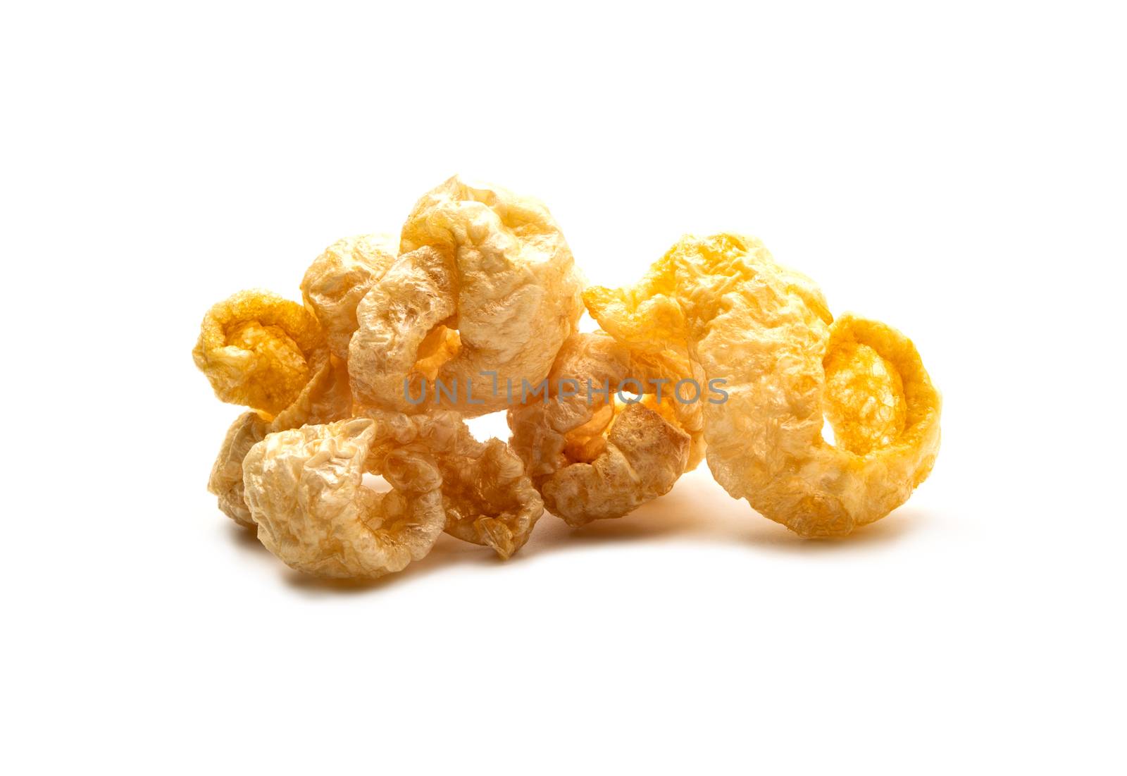 Pork snack crispy and blistered isolated on white background. Crispy pork skin pieces. Food concept.