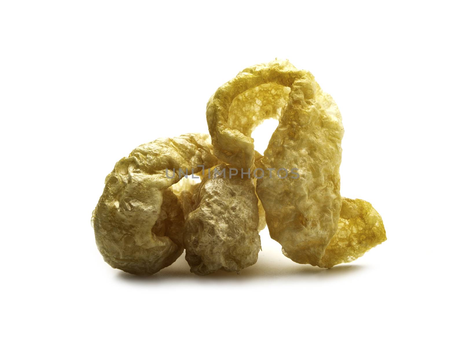 Pork snack crispy and blistered isolated on white background. Crispy pork skin pieces. Food concept.