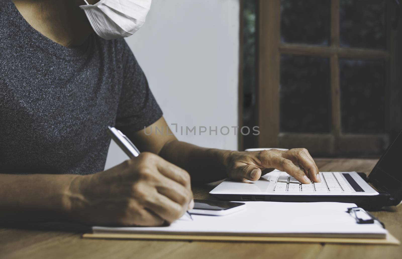 Business man working with computer laptop on wooden table at hom by kirisa99