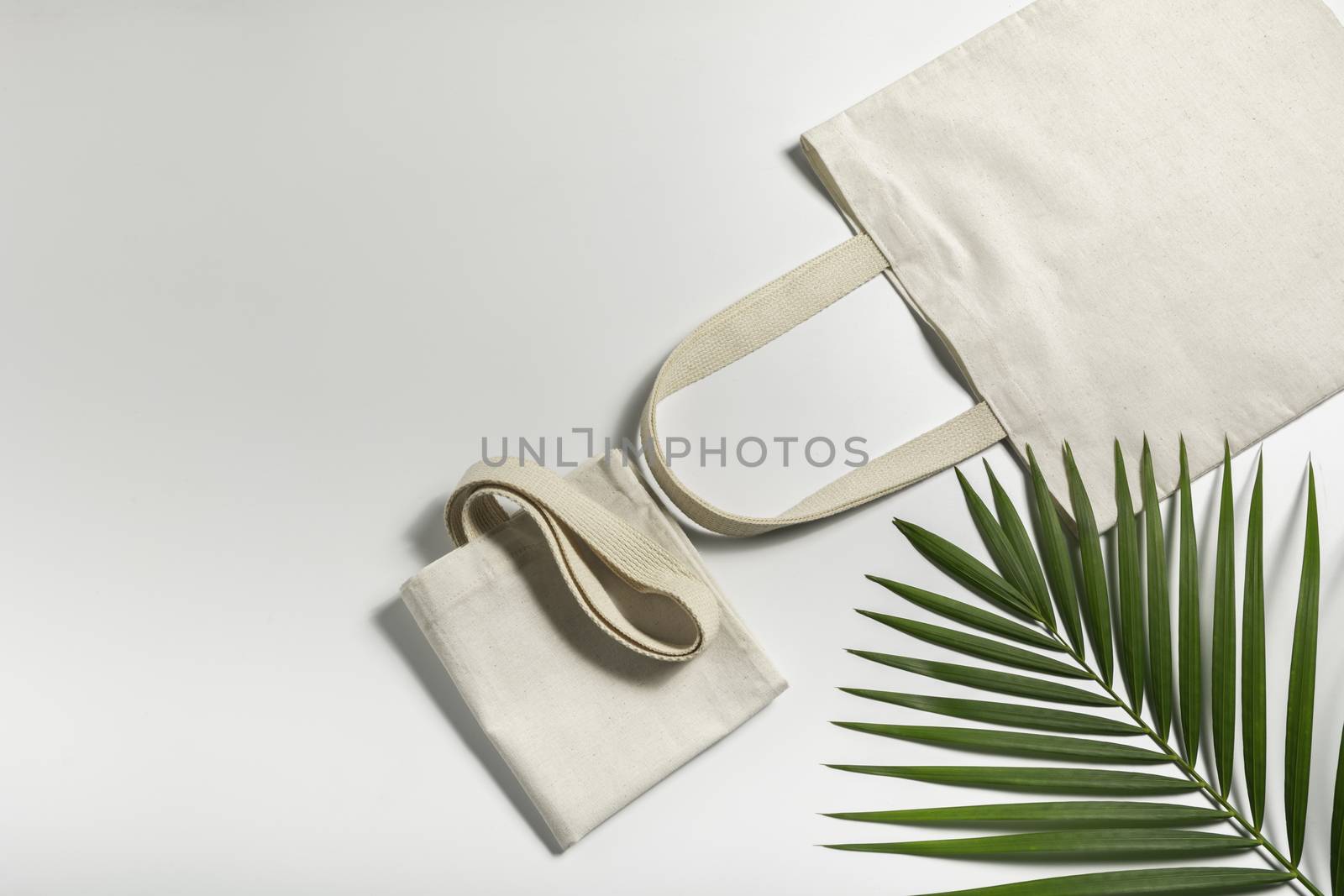 White tote bag canvas fabric. Cloth shopping sack mockup with copy space.