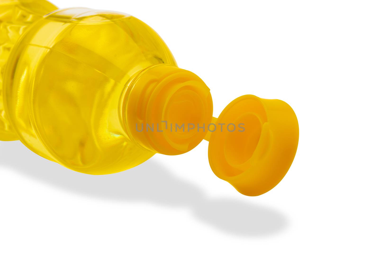 Vegetable oil in plastic bottle isolated on a white background