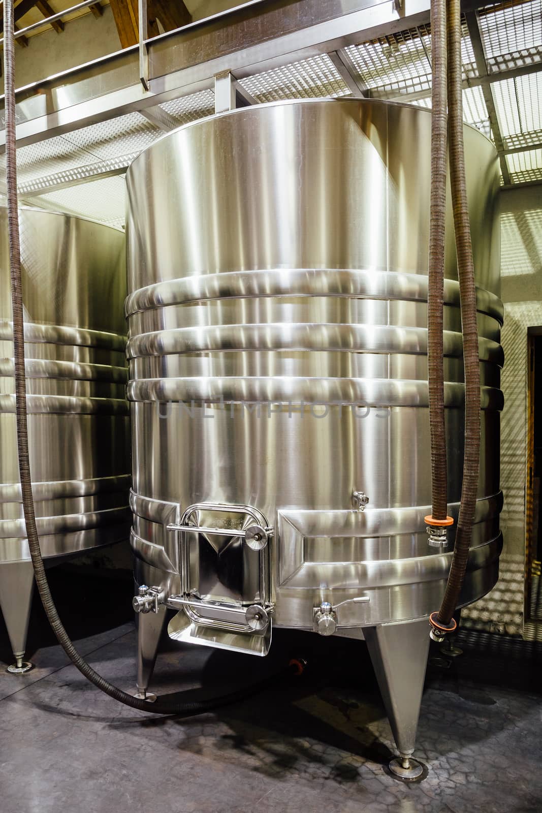 Stainless steel wine tank in a winery.