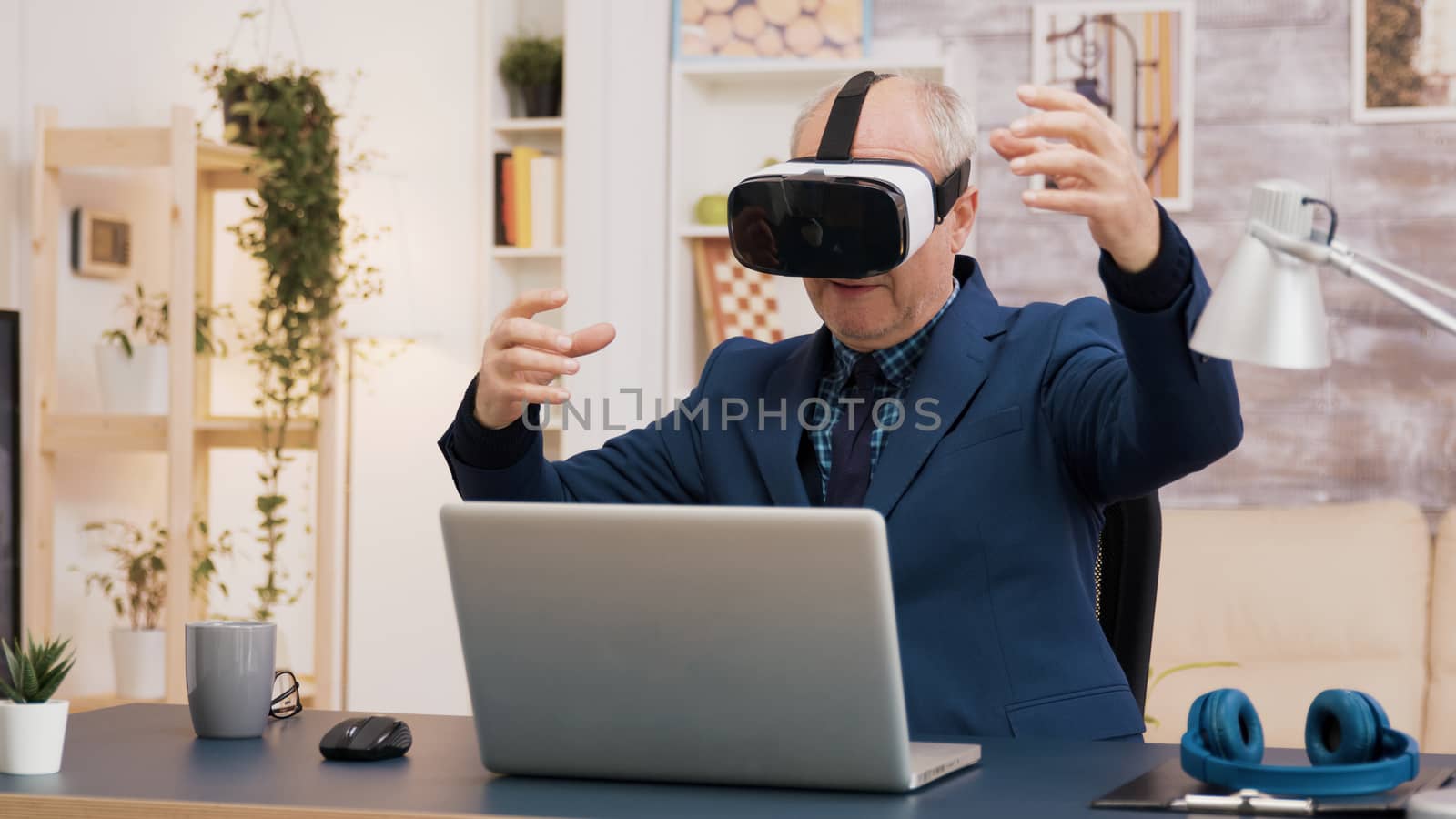 Retired man experiencing virtual reality using vr headset by DCStudio