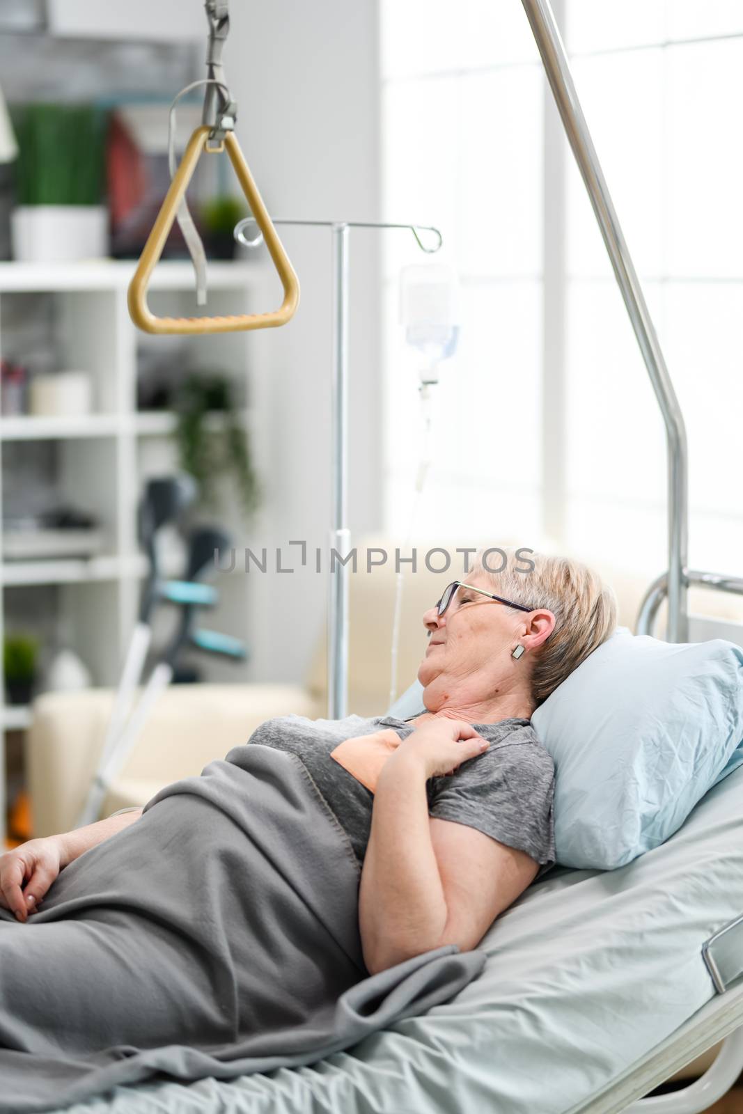 Caucasian old woman in a nursing home by DCStudio