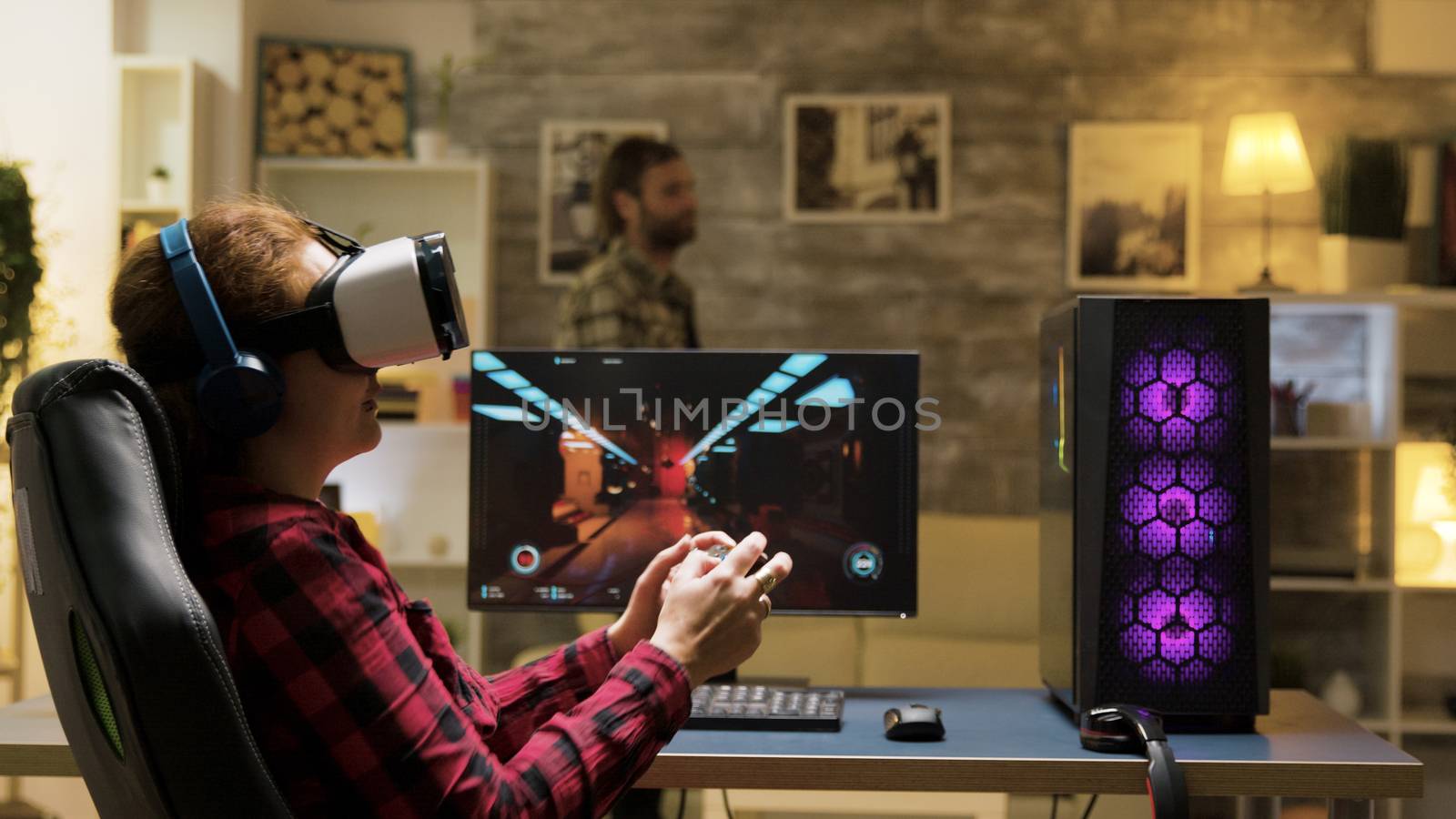 Woman relaxing playing video games using vr headset. Game over for female gamer. Man in the background.