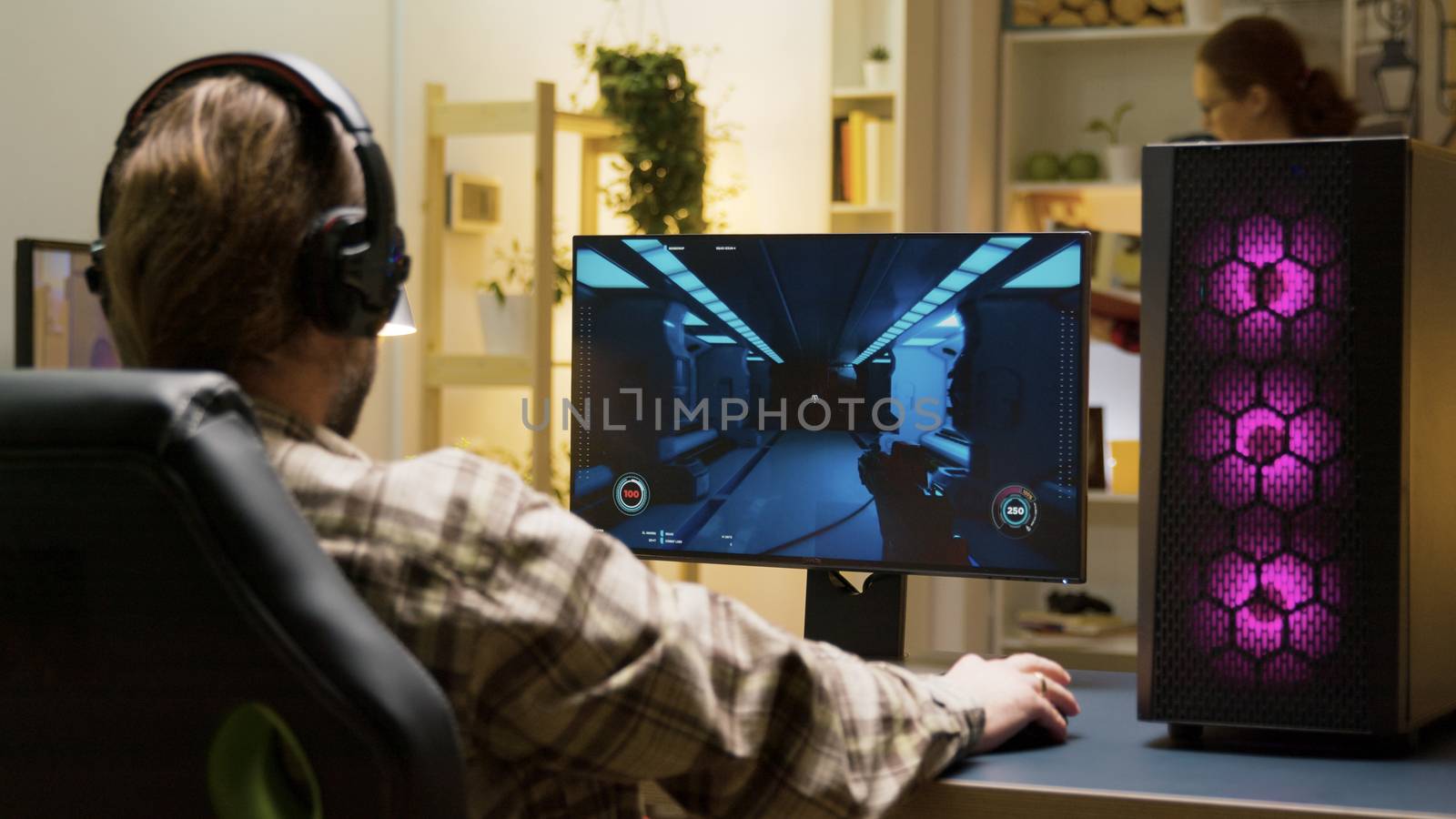 Man stretching before starting to play video games on computer by DCStudio