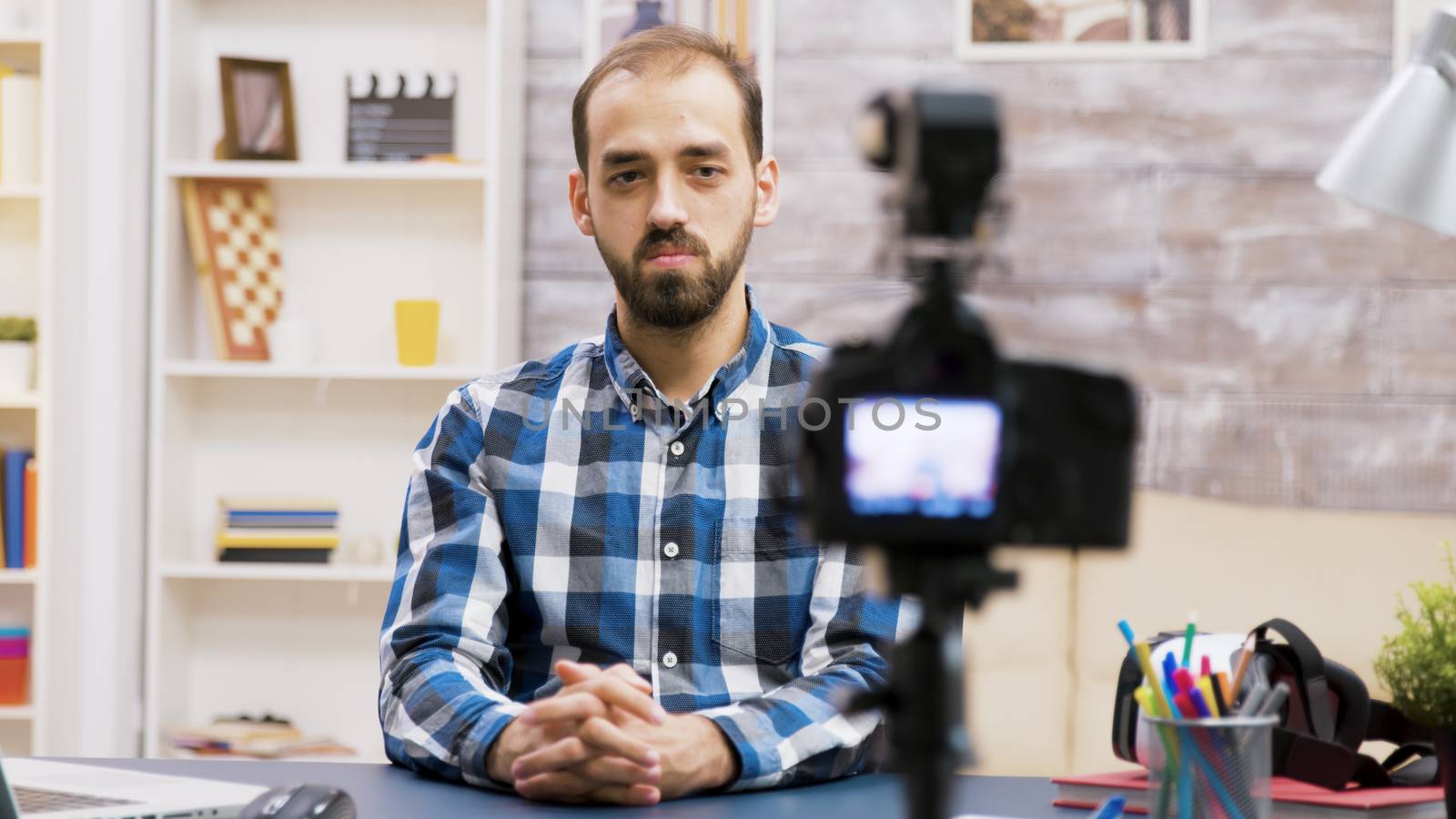 Famous young man recording a vlog for subscribers. Influencer using modern technology for vlogging.