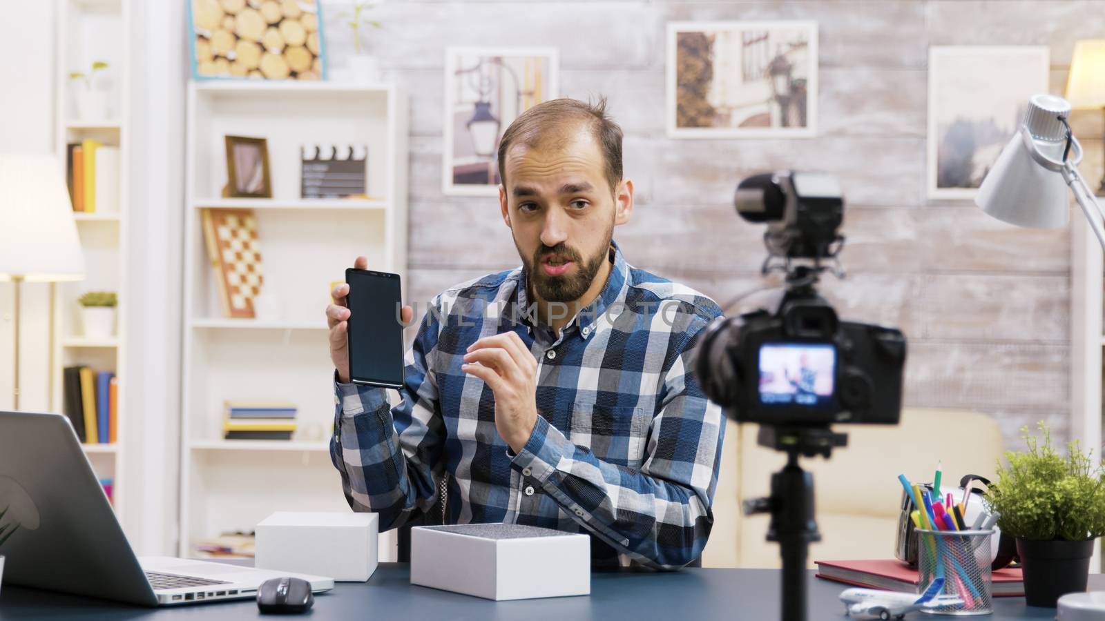 Famous young influencer recording the unboxing of a phone by DCStudio