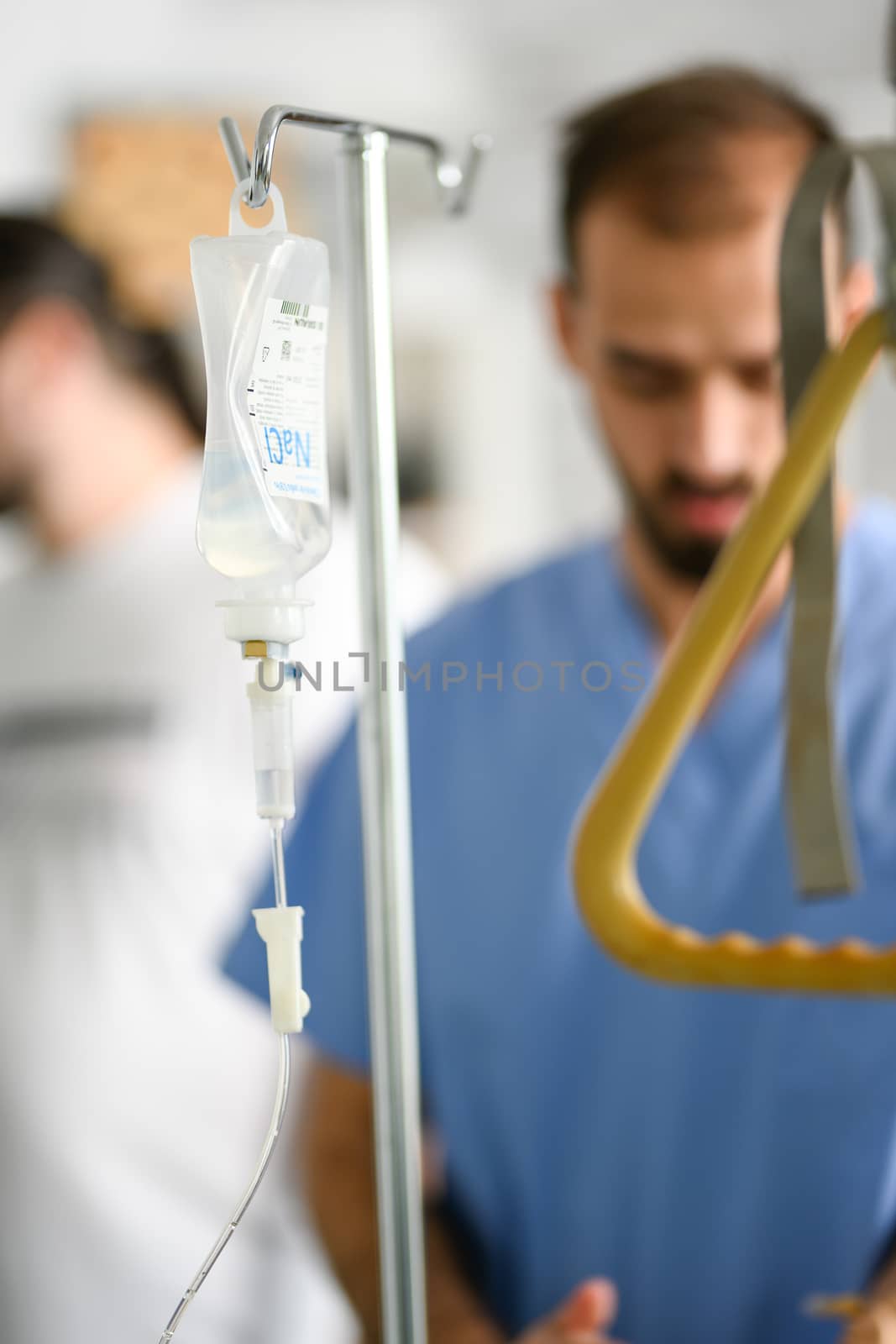 Close up of cannula in a modern nursing home and blurred doctor in the background.
