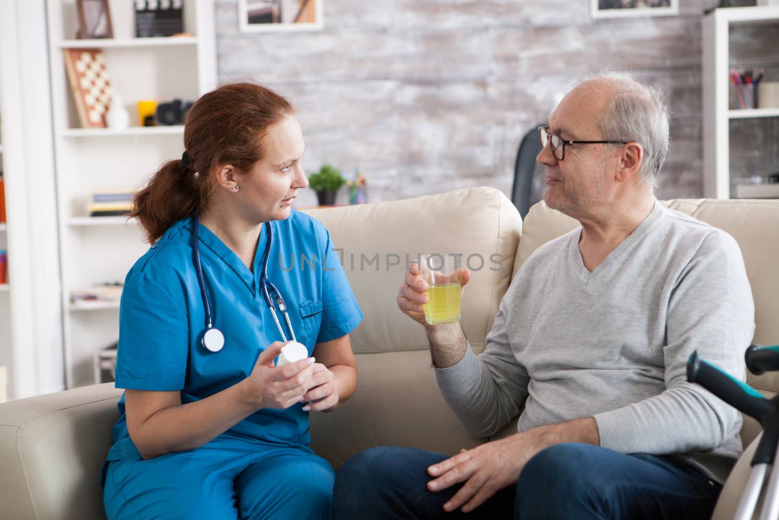 Senior man and lady nurse having a conversation by DCStudio