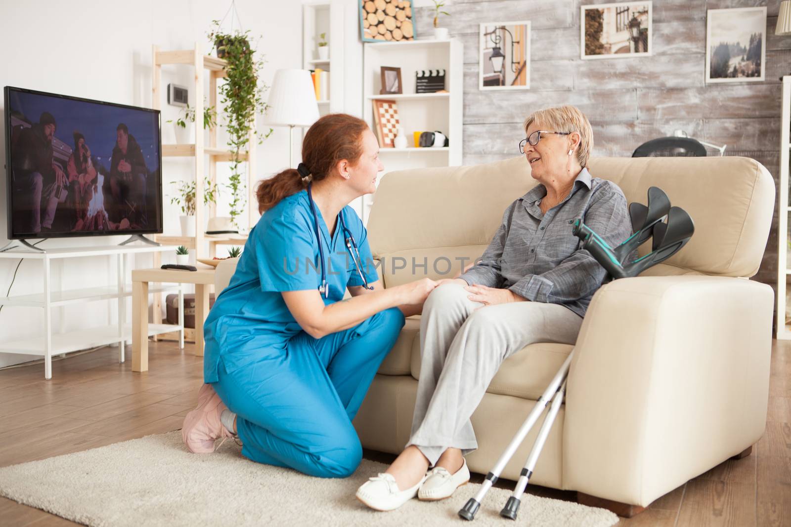 Young female nurse wearing blue uniform by DCStudio