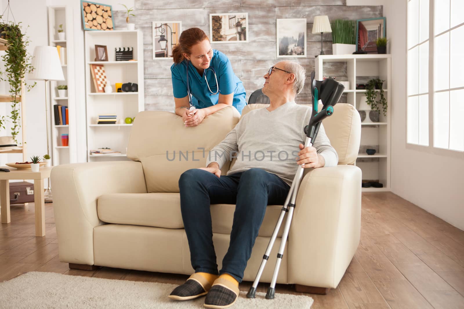 Female doctor with stethoscope in nursing home by DCStudio