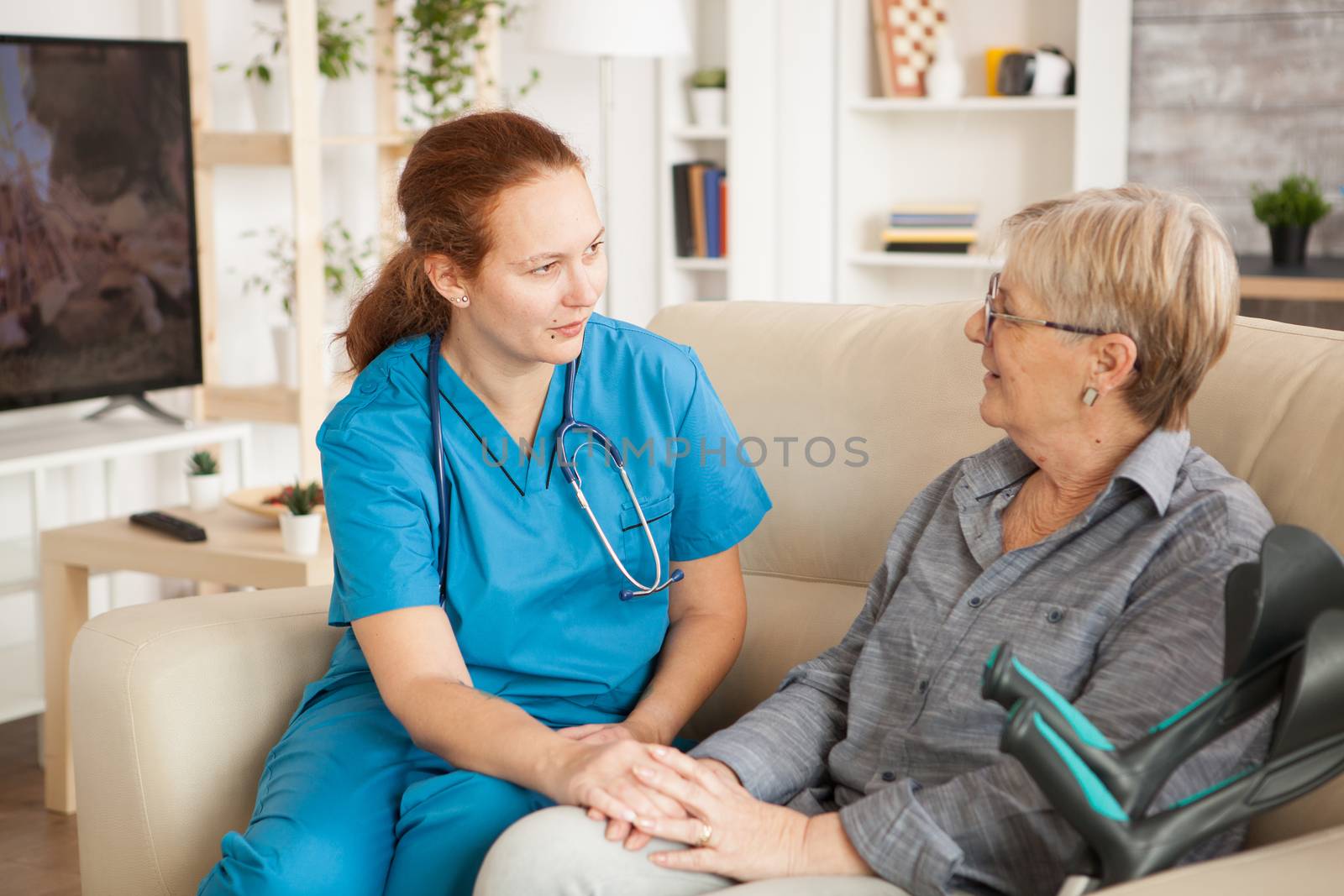 Female nurse having a conversation by DCStudio