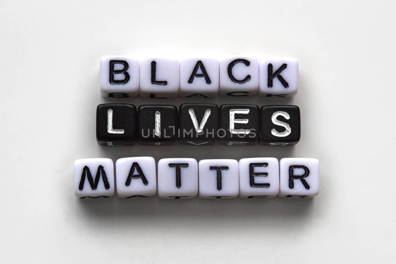 Black Lives Matter, message text with black and white cubes on a white background by oasisamuel