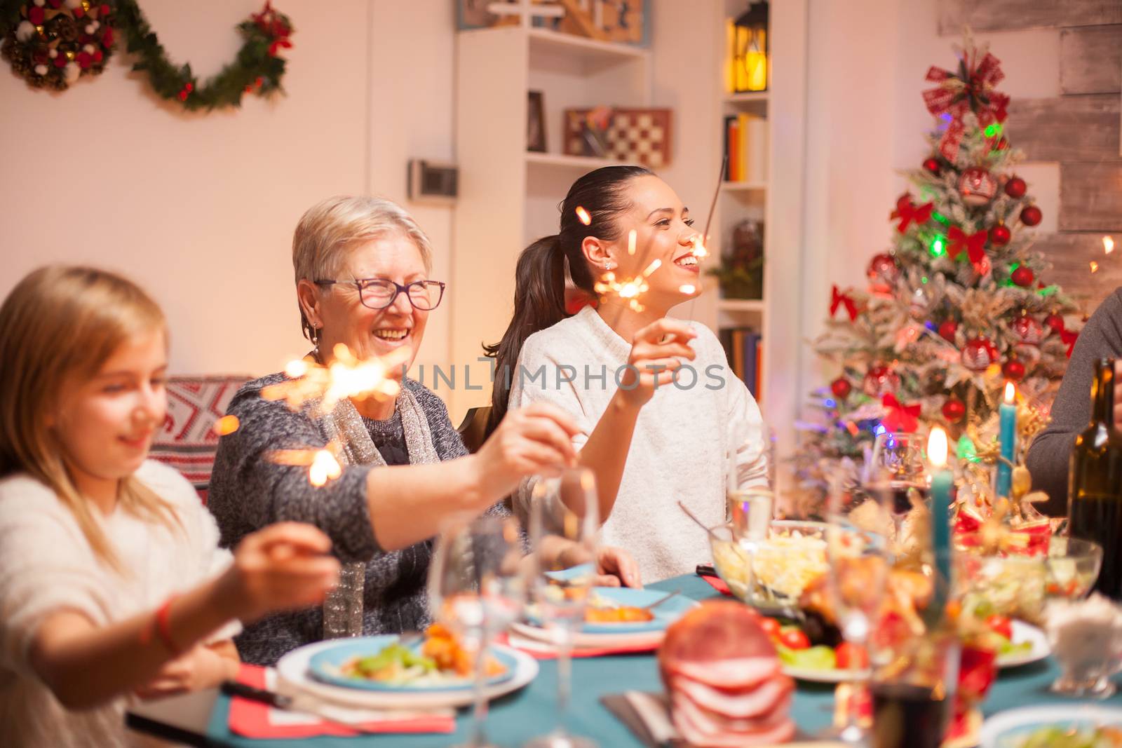 Happy senior woman at christmas celebration by DCStudio