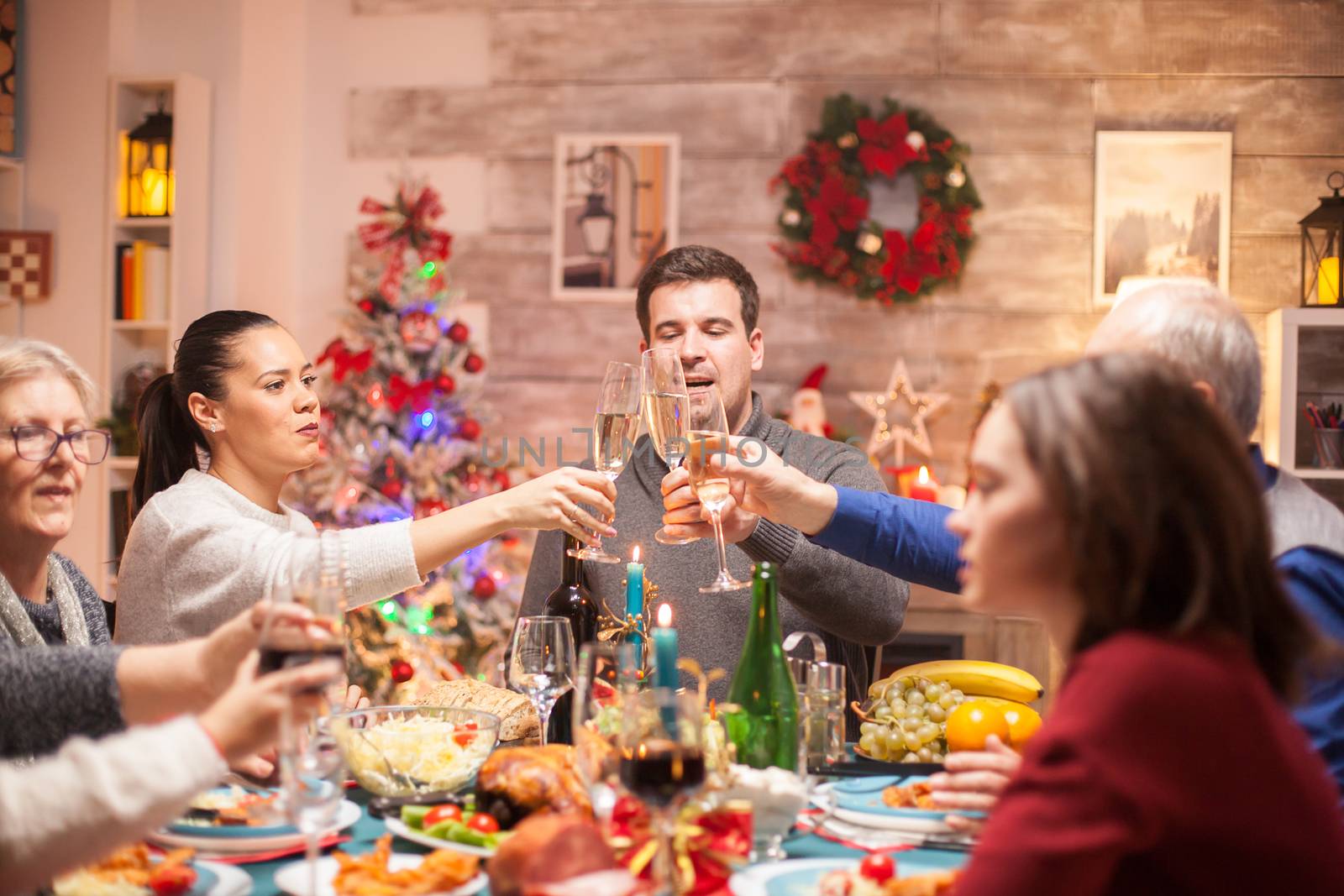 Big family at christmas dinner celebration by DCStudio