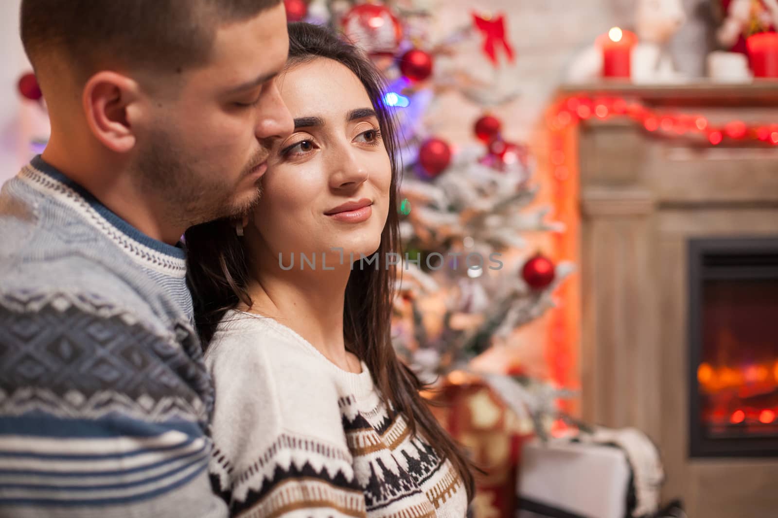 Croped shot of happy couple on christmas day.