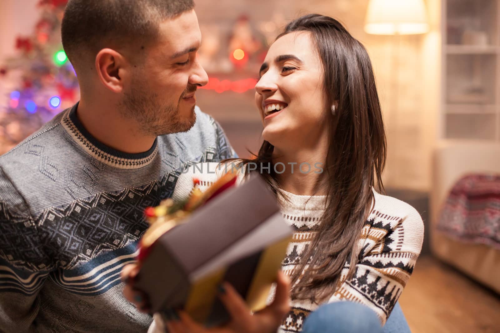 Smiling couple looking at each other by DCStudio