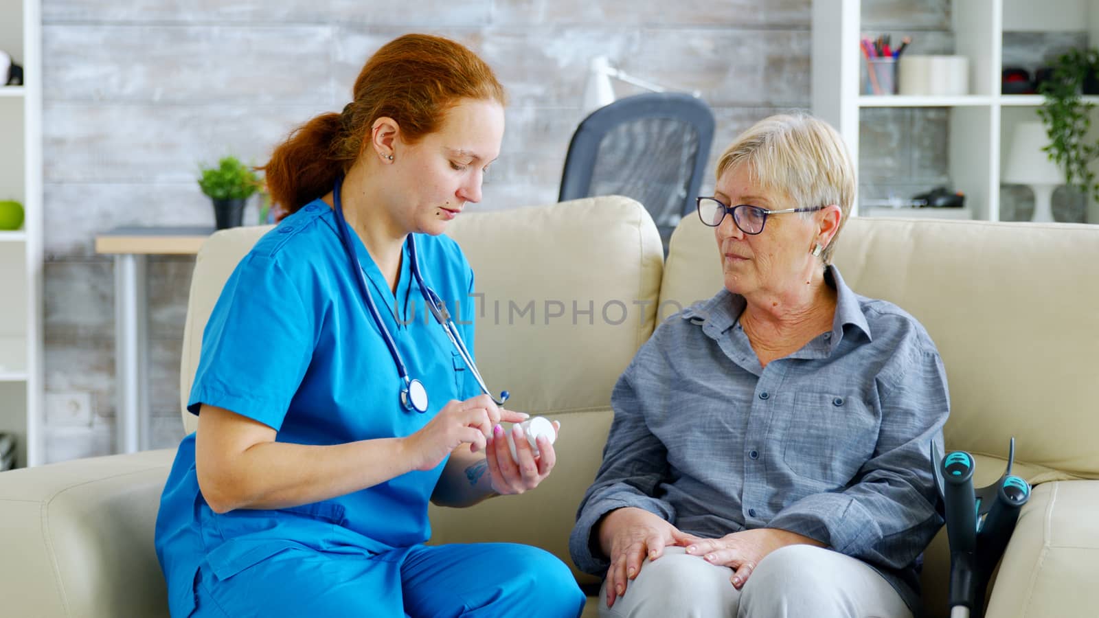 Female doctor consultin a senior woman about pills dosage and subscription by DCStudio