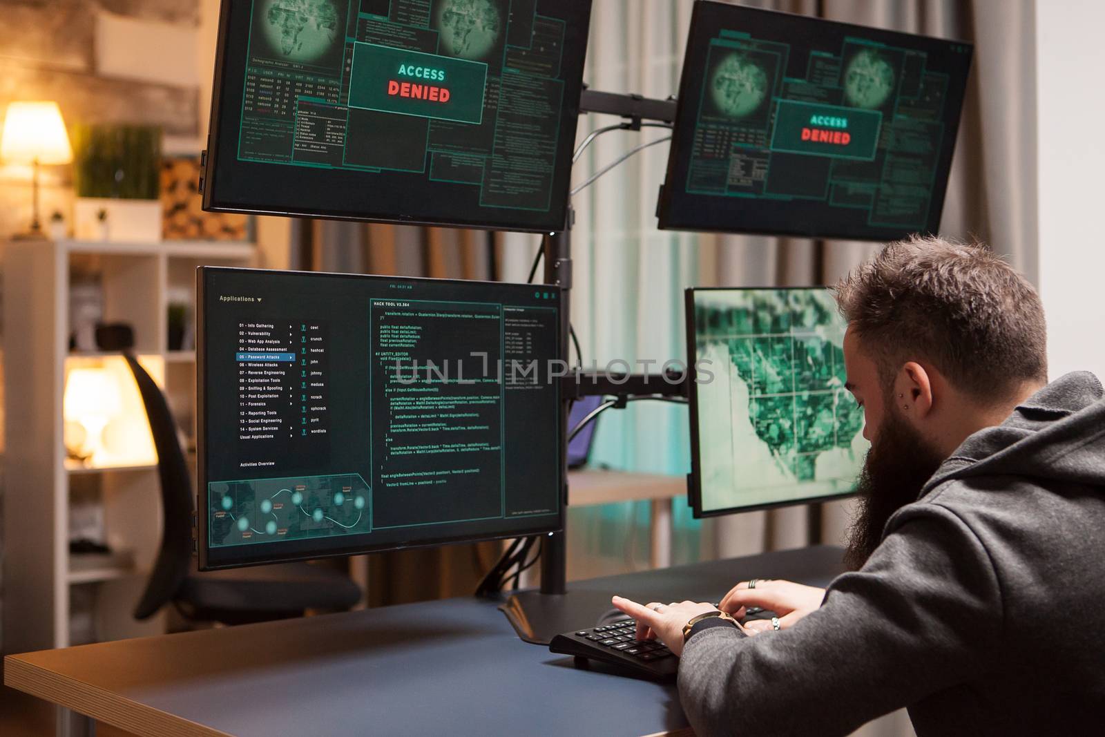 Bearded cyber terrorist gets access while typing a virus. Internet criminal.