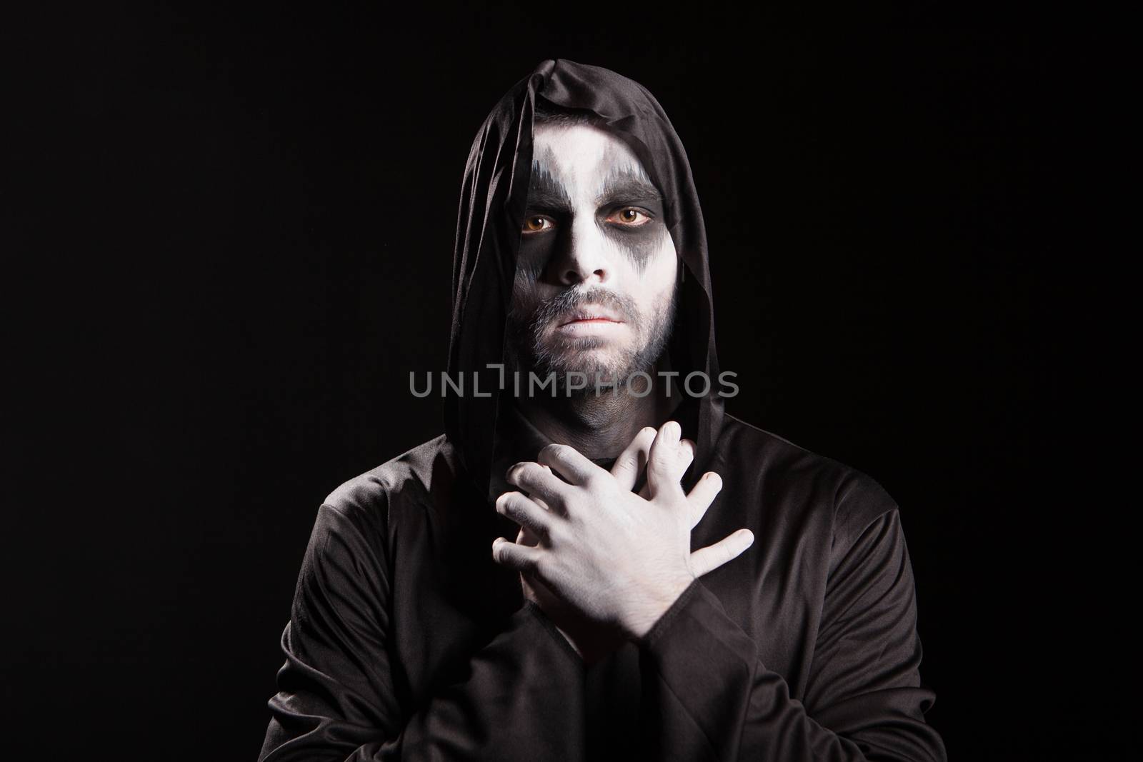 Spooky angel of death over black background with a hood by DCStudio