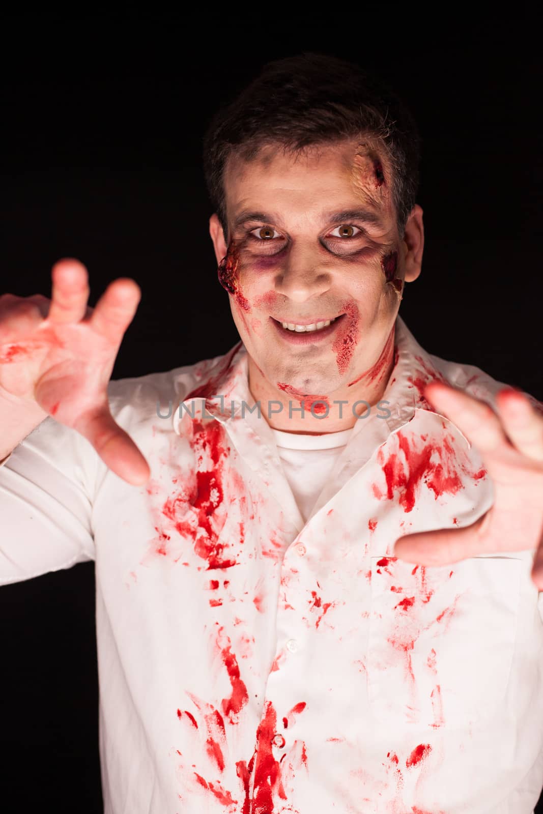 Creative make up of man dressed up like zombie for halloween.