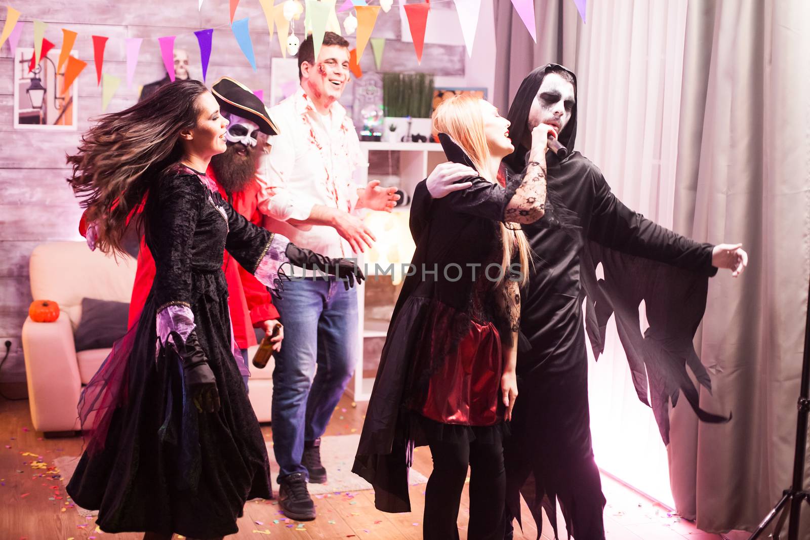 Vampire woman and grim reaper doing karaoke by DCStudio