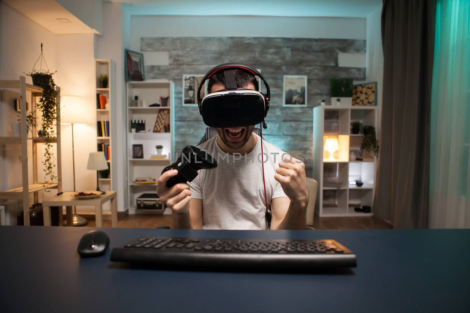 Pov of excited young man about his victory on online game by DCStudio